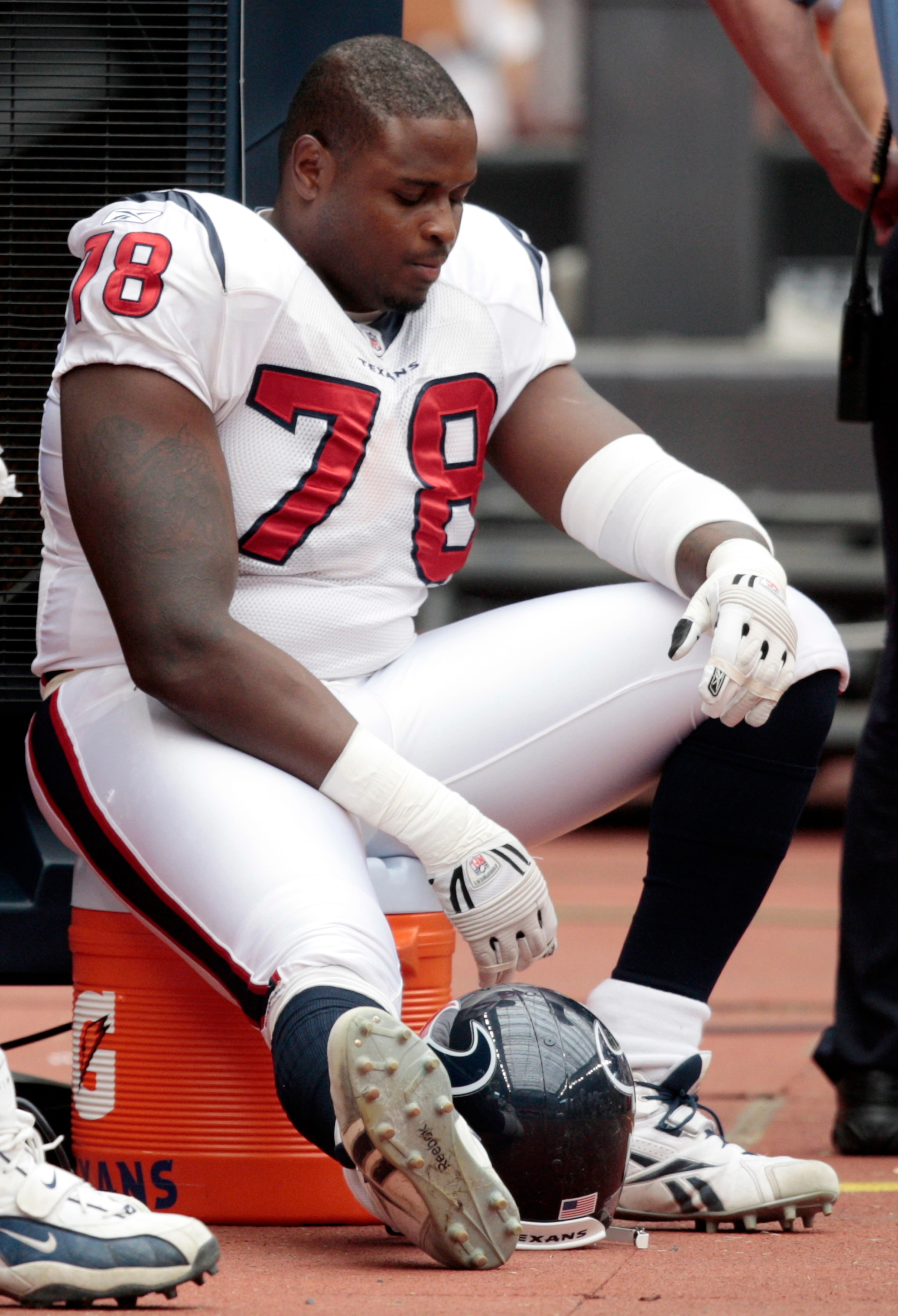 HOUSTON - SEPTEMBER 13:  A dejected  Rashad Butler #78 of the Houston Texans sits on the bench at Reliant Stadium on September 13, 2009 in Houston, Texas.  (Photo by Bob Levey/Getty Images)