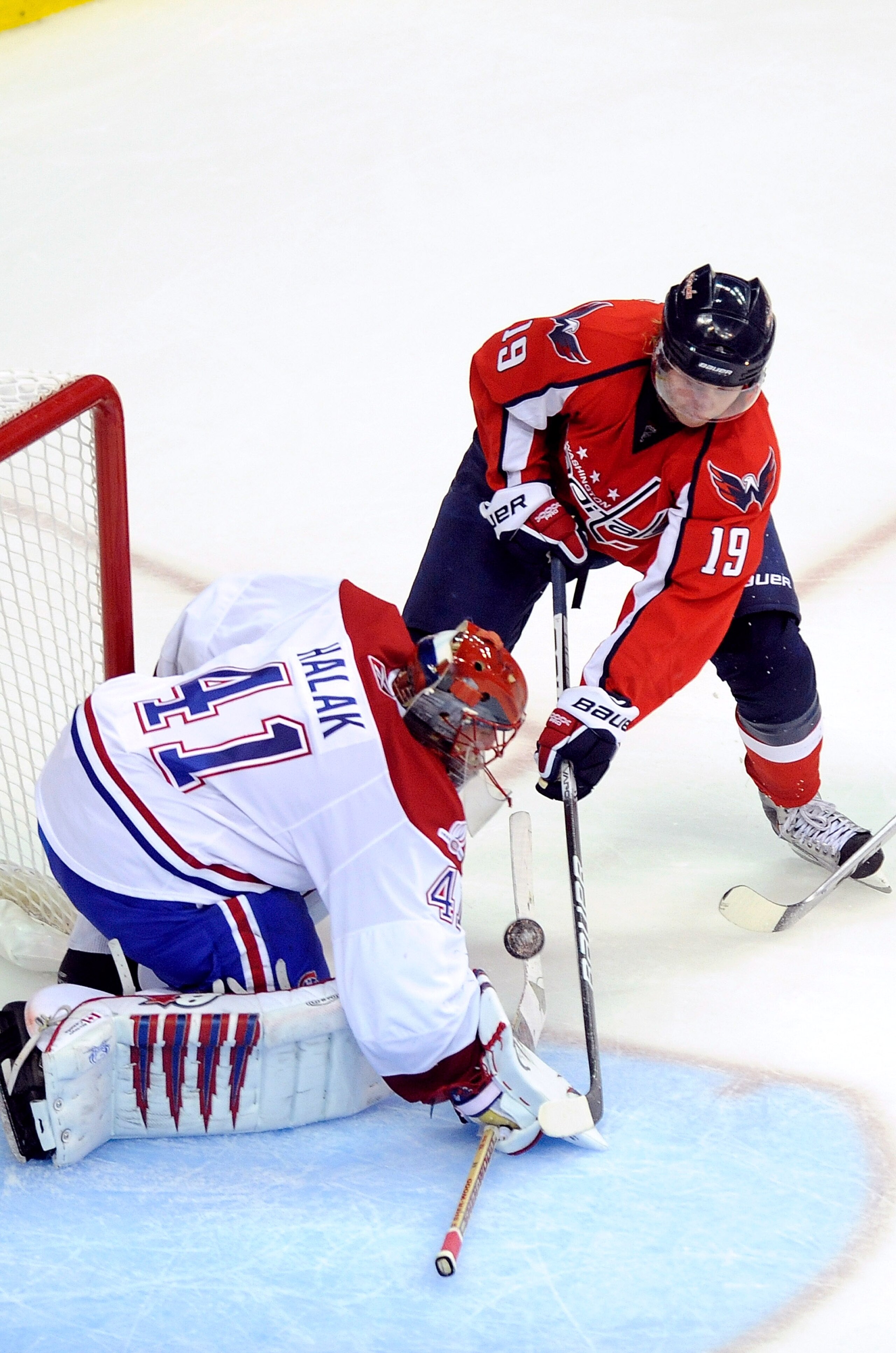 WASHINGTON - APRIL 15:  Jaroslav Halak #41 of the Montreal Canadiens makes a save against Nicklas Backstrom #19 of the Washington Capitals in Game One of the Eastern Conference Quarterfinals during the 2010 NHL Stanley Cup Playoffs at Verizon Center on Ap