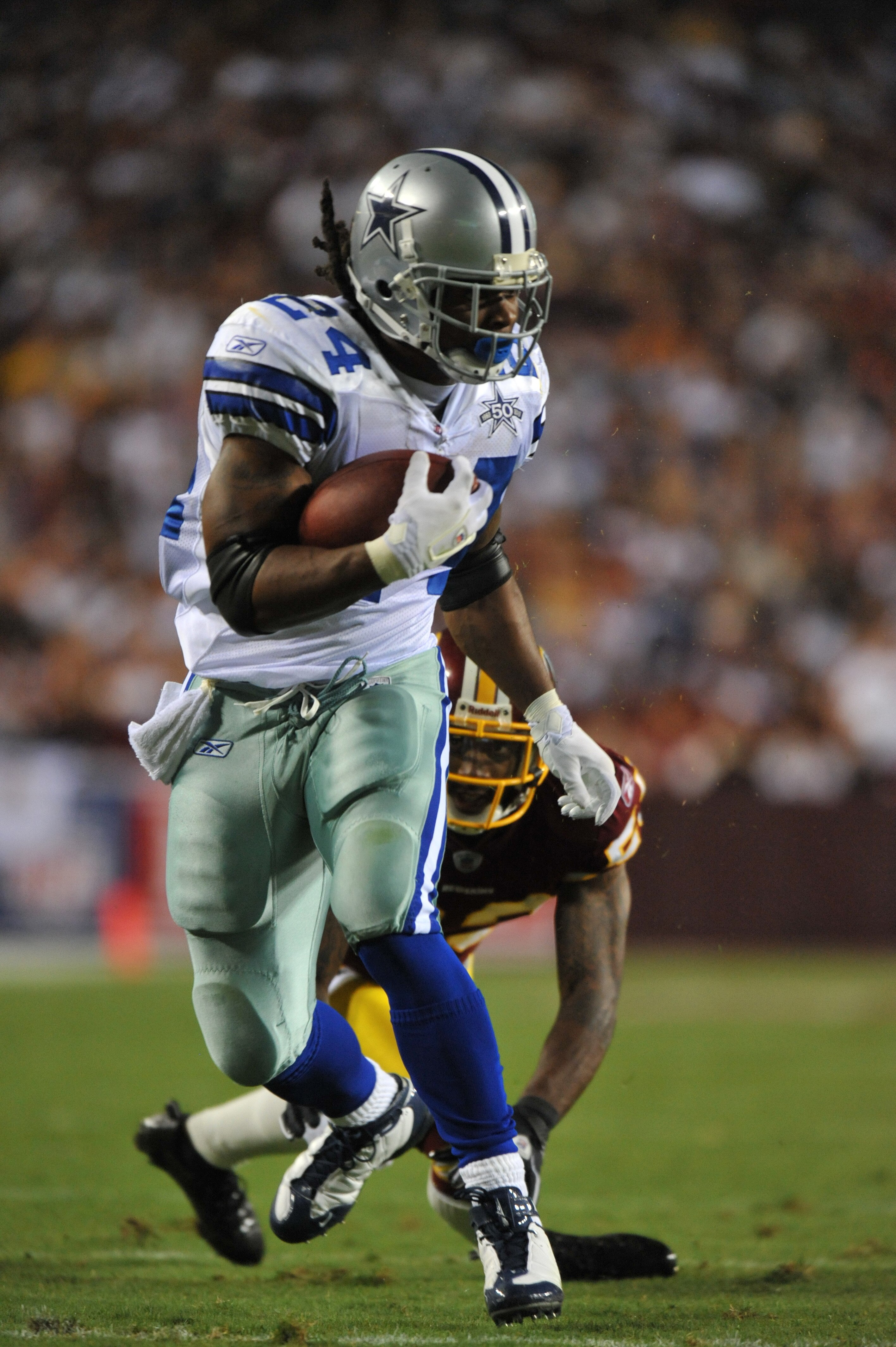 LANDOVER - SEPTEMBER 12:  Marion Barber #24 of the Dallas Cowboys runs the ball during the NFL season opener against the Washington Redskins at FedExField on September 12, 2010 in Landover, Maryland. The Redskins defeated the Cowboys 13-7. (Photo by Larry