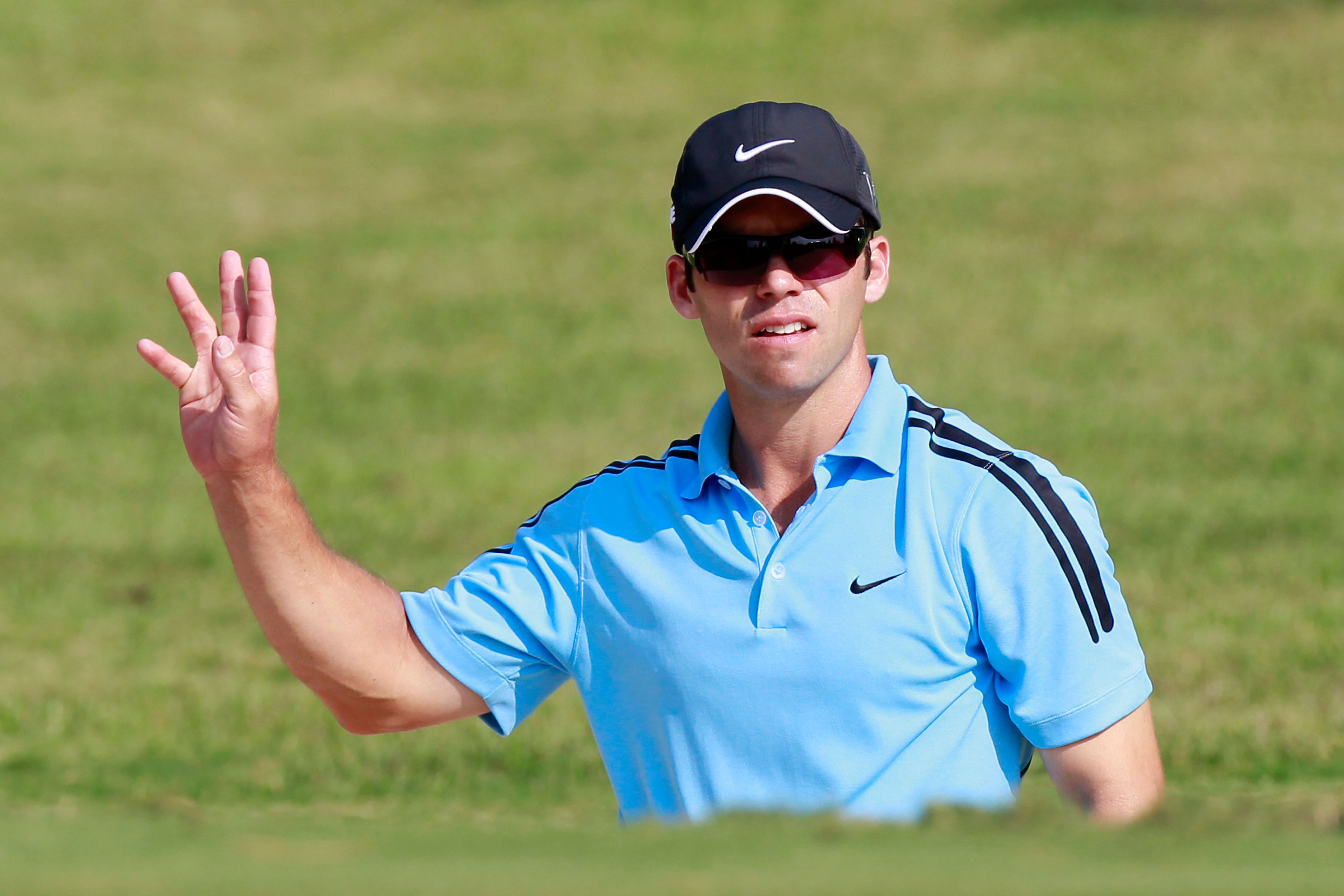 ATLANTA - SEPTEMBER 23:  Paul Casey of England reacts after his sand shot on the 14th green during the first round of THE TOUR Championship presented by Coca-Cola at East Lake Golf Club on September 23, 2010 in Atlanta, Georgia.  (Photo by Kevin C. Cox/Ge