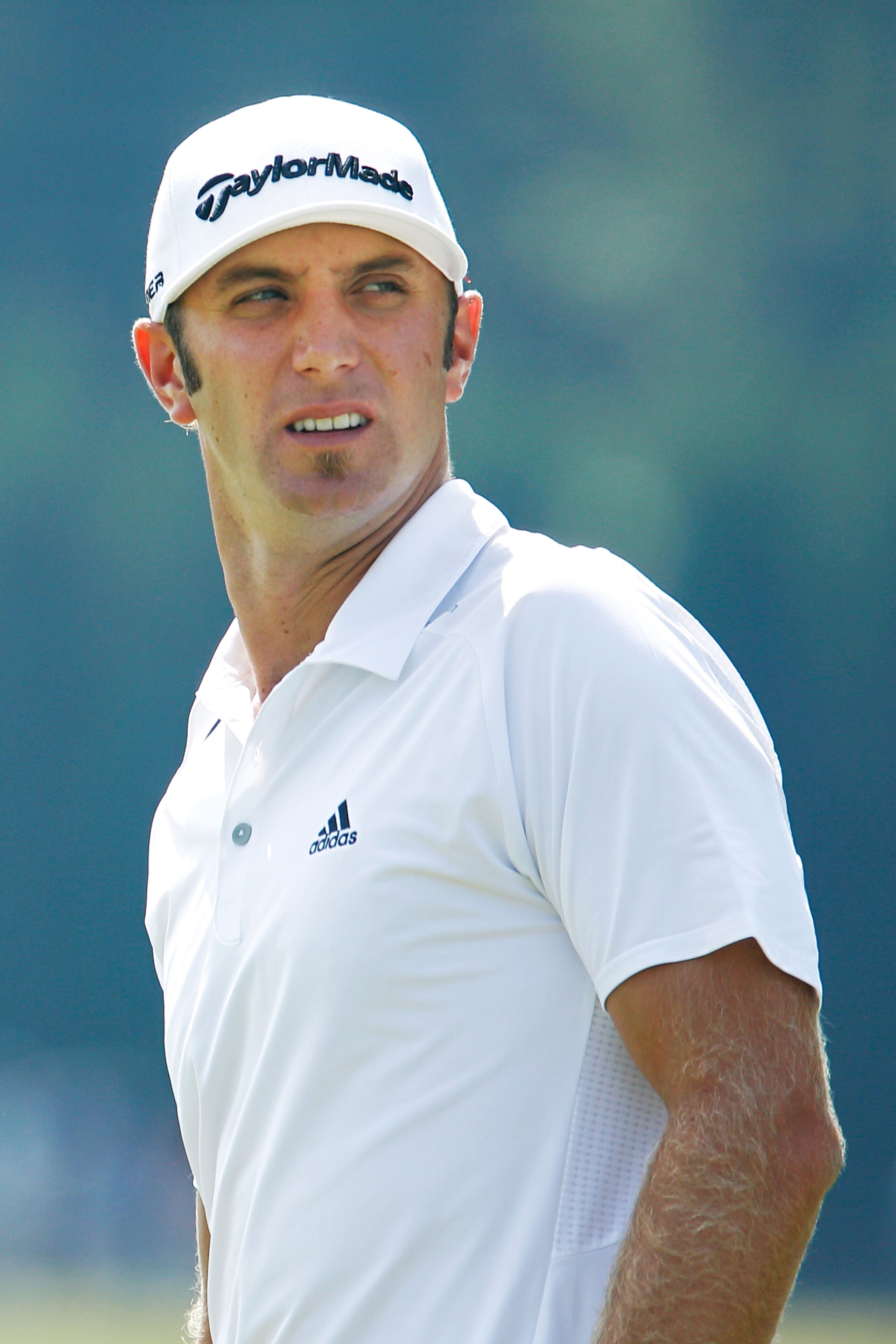 ATLANTA - SEPTEMBER 23:  Dustin Johnson looks on from the practice range prior to playing his first round of THE TOUR Championship presented by Coca-Cola at East Lake Golf Club on September 23, 2010 in Atlanta, Georgia.  (Photo by Scott Halleran/Getty Ima