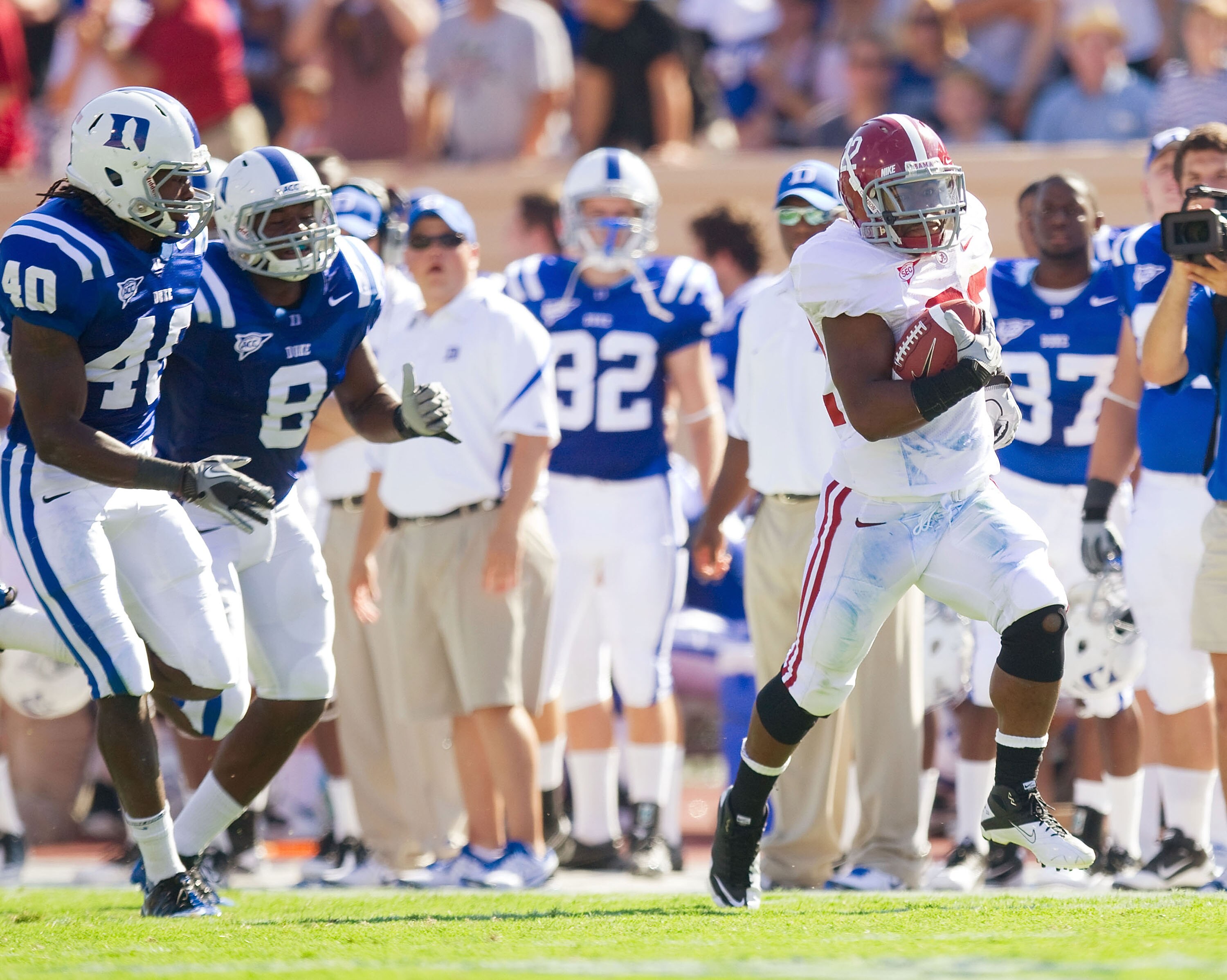 DURHAM, NC - SEPTEMBER 18: Mark Ingram #22 of the Alabama Crimson Tide runs down the sideline while being pursued by Abraham Kromah #8 and Matt Daniels #40 of the Duke Blue Devils at Wallace Wade Stadium on September 18, 2010 in Durham, North Carolina.  T