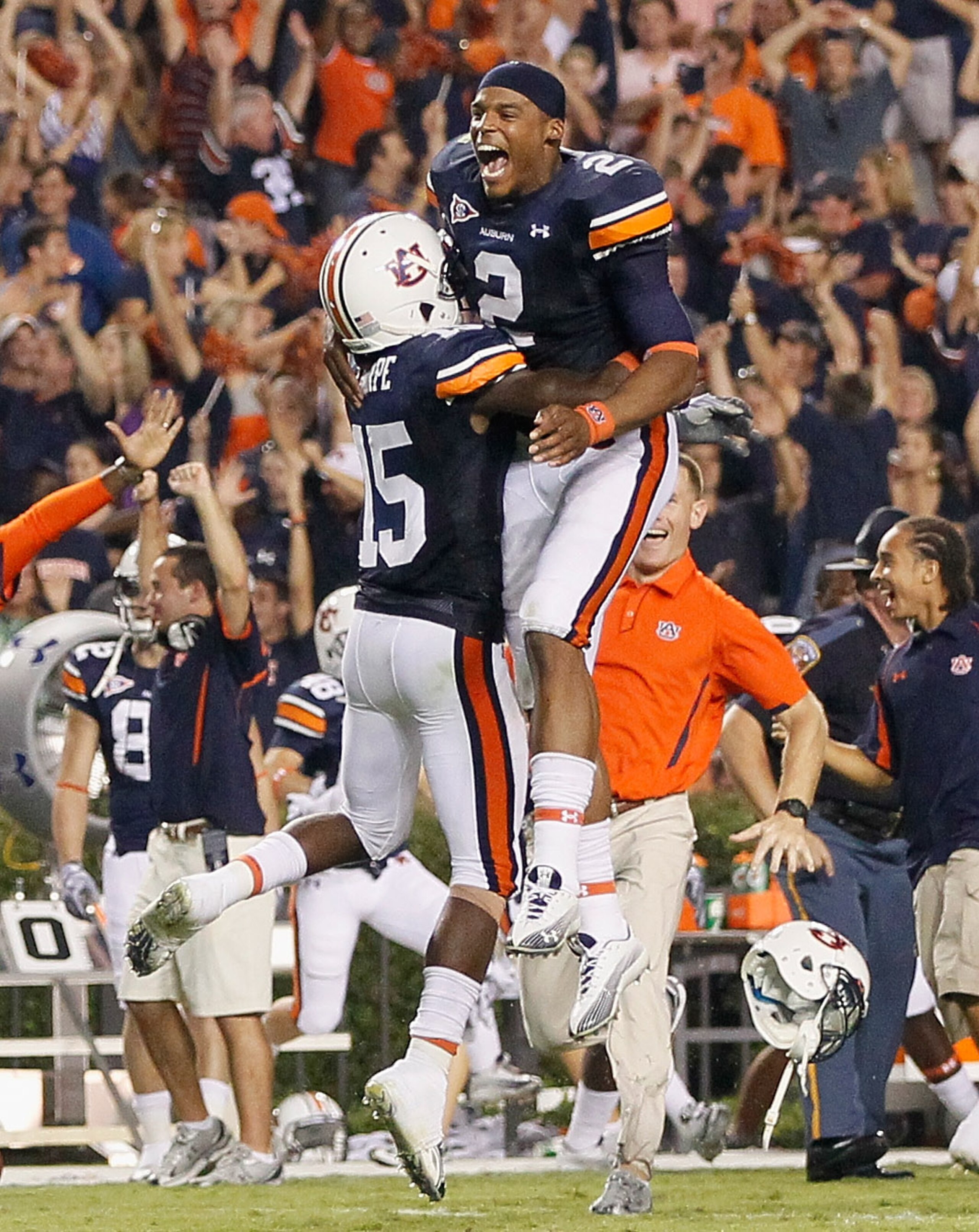 AUBURN, AL - SEPTEMBER 18:  Quarterback Cameron Newton #2 and Neiko Thorpe #15 of the Auburn Tigers celebrate after their 27-24 overtime win over the Clemson Tigers at Jordan-Hare Stadium on September 18, 2010 in Auburn, Alabama.  (Photo by Kevin C. Cox/G