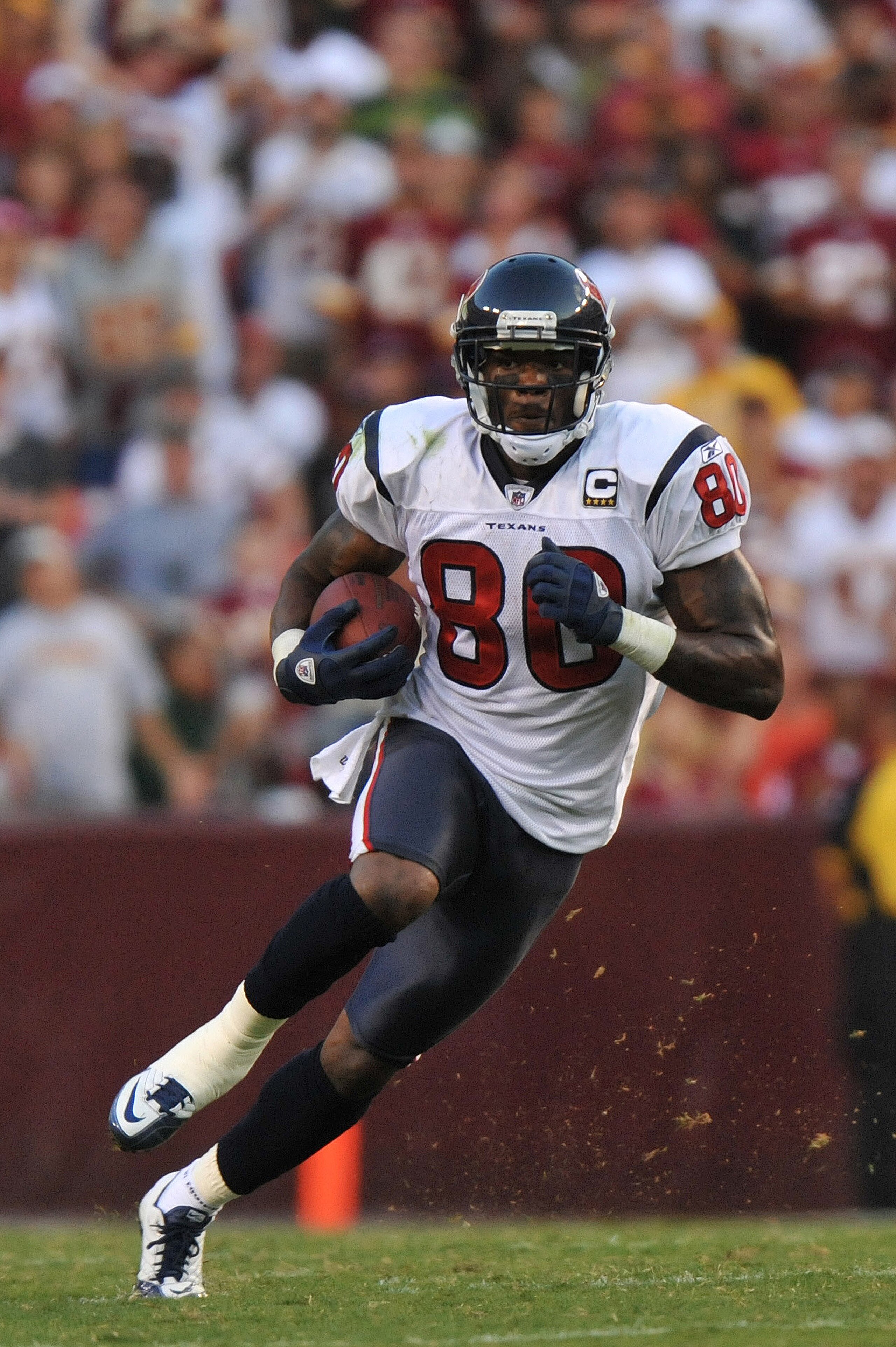 LANDOVER, MD - SEPTEMBER 19:  Andre Johnson #80 of the Houston Texans runs the ball against the Washington Redskins at FedExField on September 19, 2010 in Landover, Maryland. The Texans defeated the Redskins in overtime 30-27. (Photo by Larry French/Getty