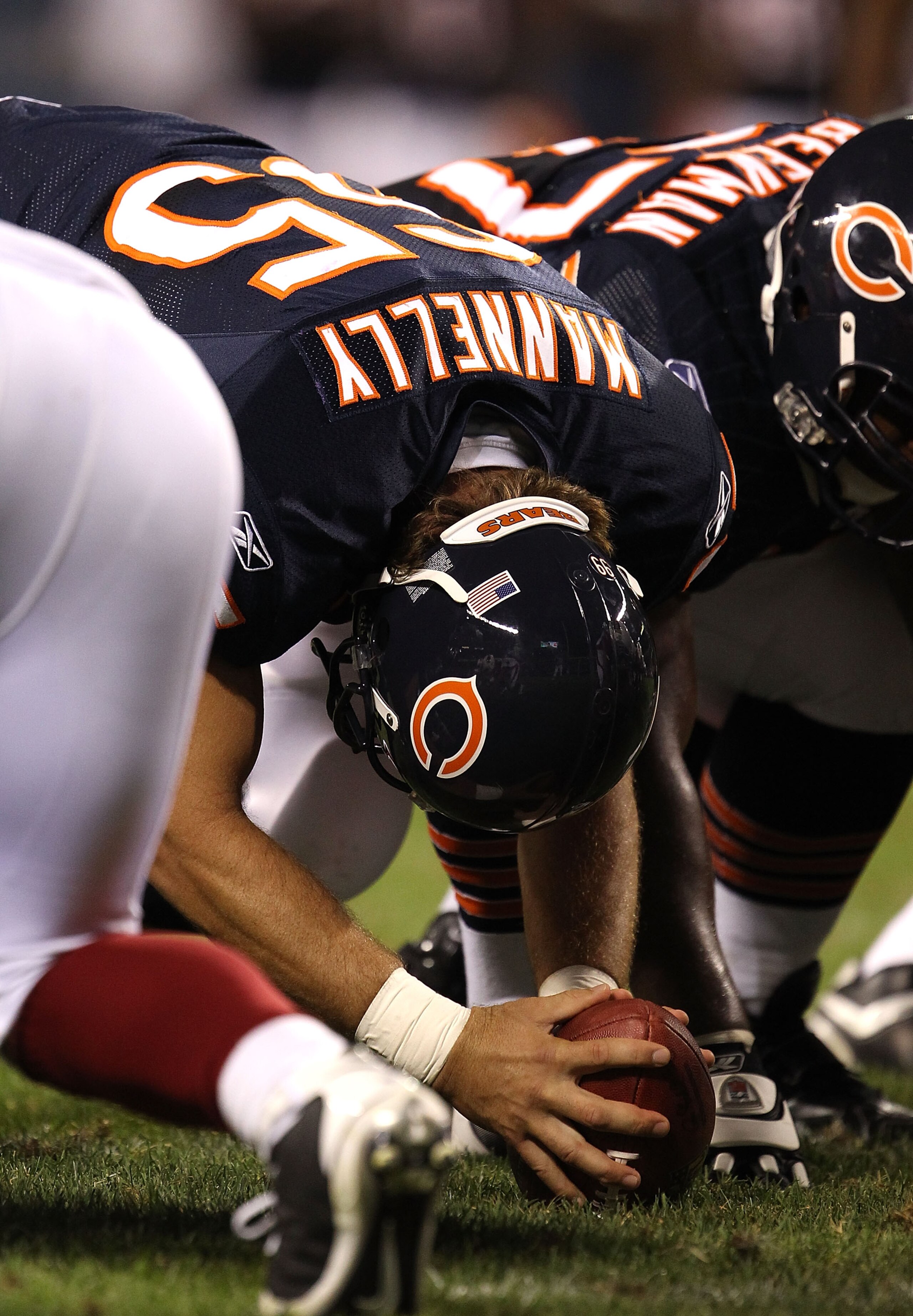 CHICAGO - AUGUST 28: Patrick Mannelly #65 of the Chicago Bears prepares to snap the ball against the Arizona Cardinals during a preseason game at Soldier Field on August 28, 2010 in Chicago, Illinois. The Cardinals defeated the Bears 14-9. (Photo by Jonat