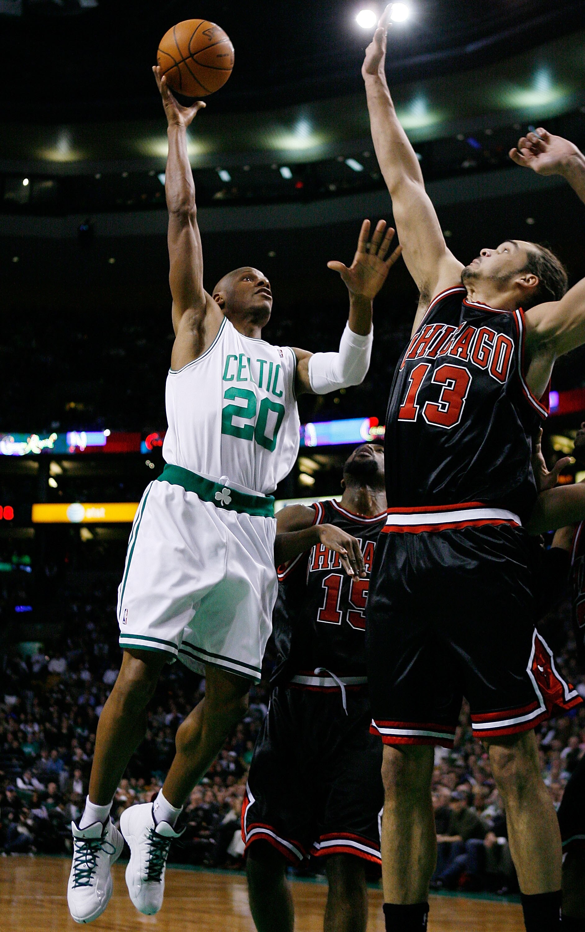 BOSTON - JANUARY 14:  Ray Allen #20 of the Boston Celtics takes a shot as Joakim Noah #13 of the Chicago Bulls defends at the TD Garden on January 14, 2010 in Boston, Massachusetts.  NOTE TO USER: User expressly acknowledges and agrees that, by downloadin