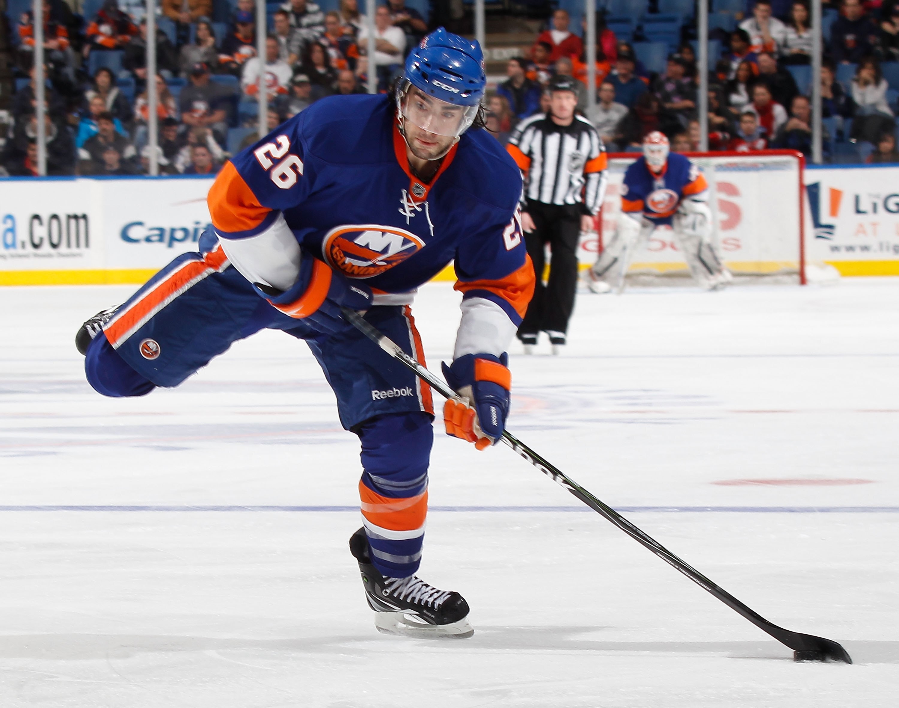 UNIONDALE, NY - MARCH 13:  Matt Moulson #26 of the New York Islanders shoots the puck at an NHL game against the New Jersey Devils at the Nassau Coliseum on March 13, 2010 in Uniondale, New York.  (Photo by Paul Bereswill/Getty Images)