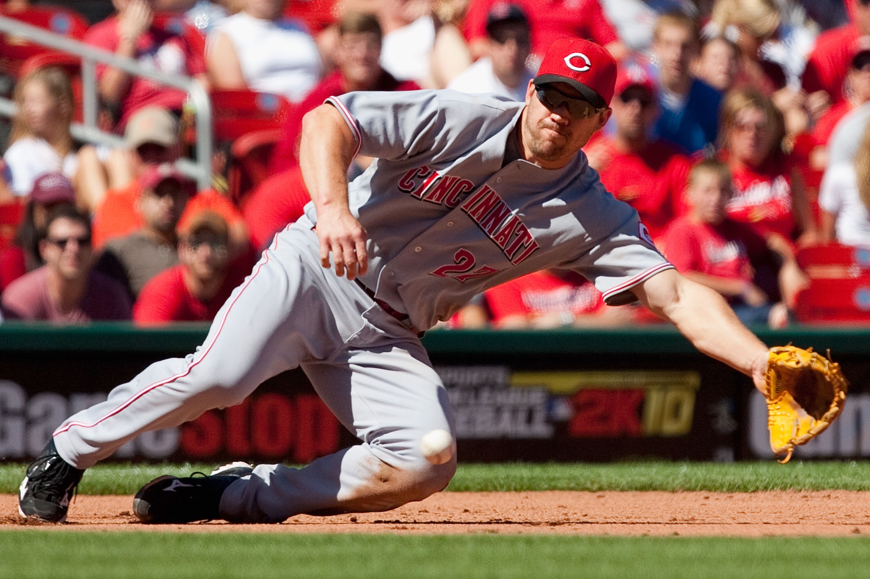 ST. LOUIS - SEPTEMBER 5: Scott Rolen #27 of the Cincinnati Reds fields a ground ball against the St. Louis Cardinals at Busch Stadium on September 5, 2010 in St. Louis, Missouri.  The Cardinals beat the Reds 4-2.  (Photo by Dilip Vishwanat/Getty Images)