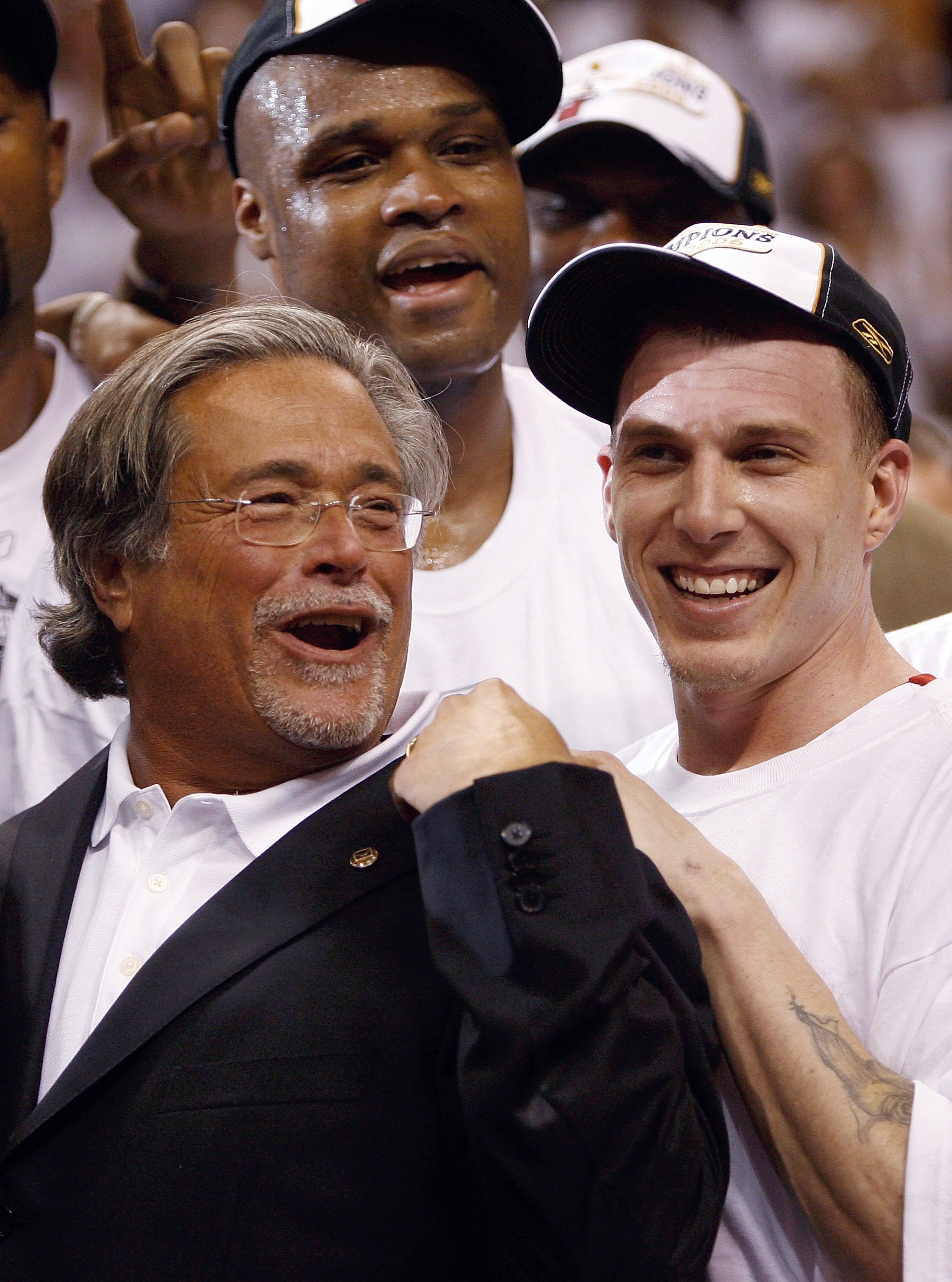 MIAMI - JUNE 2:  (L-R) Team owner Mickey Arison, Antoine Walker #8 and Jason Williams #55 of the Miami Heat celebrate after defeating the Detroit Pistons in game six of the Eastern Conference Finals during the 2006 NBA Playoffs on June 2, 2006 at American