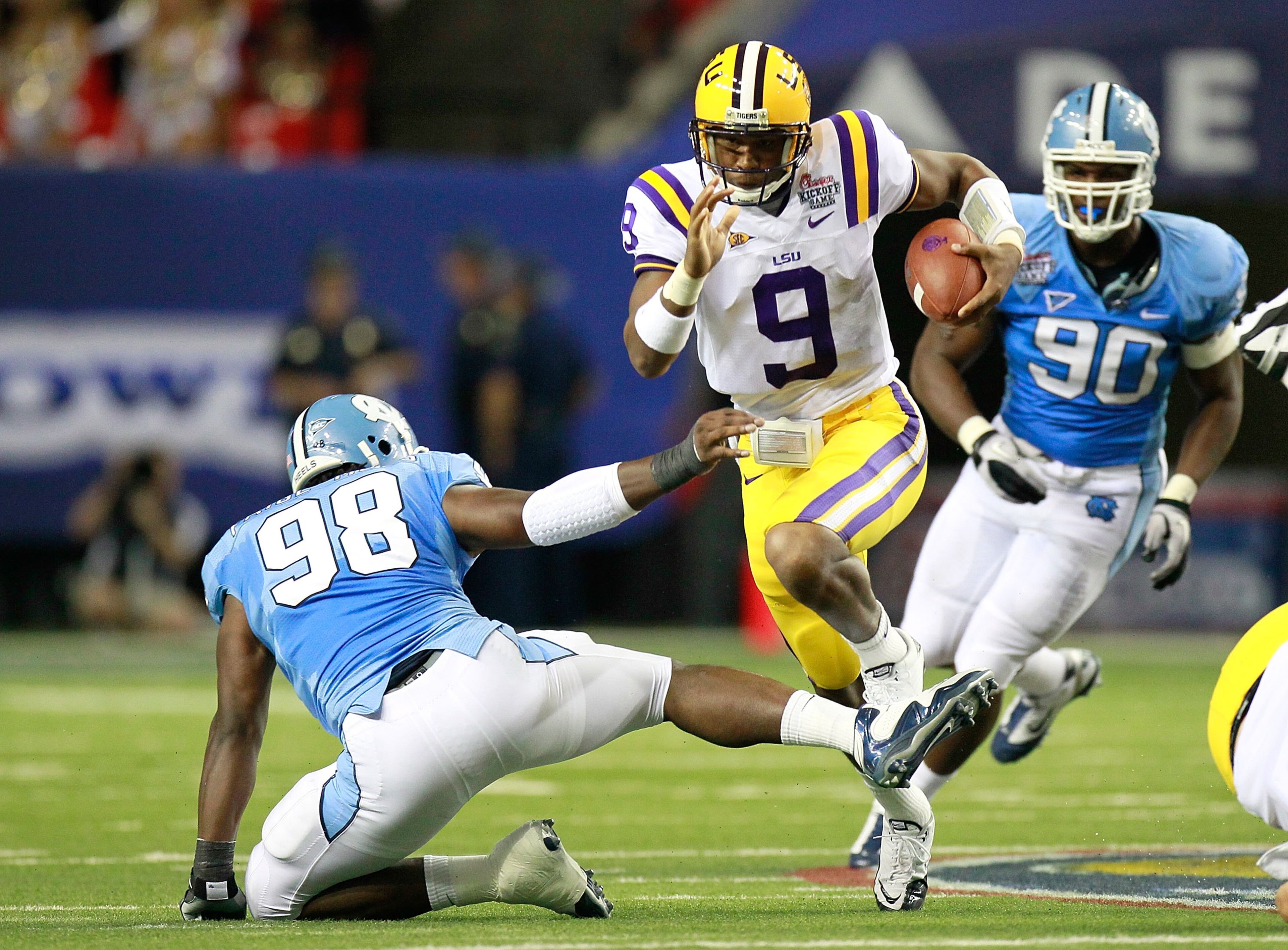 ATLANTA - SEPTEMBER 04: Quarterback Jordan Jefferson #9 of the LSU Tigers is tripped up by Donte Paige-Moss #98 of the North Carolina Tar Heels during the Chick-fil-A Kickoff Game at Georgia Dome on September 4, 2010 in Atlanta, Georgia. (Photo by Kevin ATLANTA - SEPTEMBER 04: Quarterback Jordan Jefferson #9 of the LSU Tigers is tripped up by Donte Paige-Moss #98 of the North Carolina Tar Heels during the Chick-fil-A Kickoff Game at Georgia Dome on September 4, 2010 in Atlanta, Georgia. (Photo by Kevin