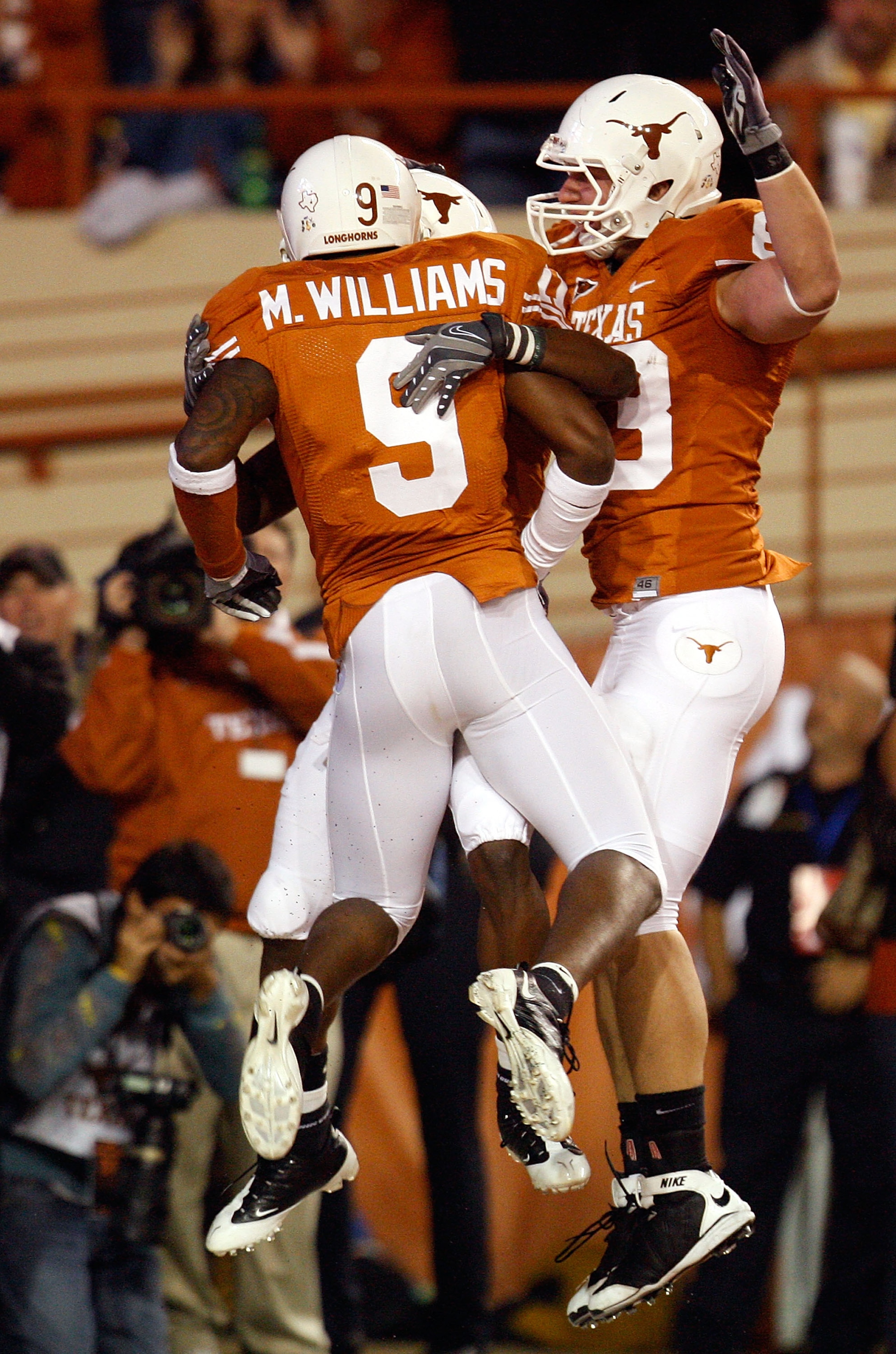 AUSTIN, TX - NOVEMBER 21: Wide receiver James Kirkendoll #11 of the Texas Longhorns celebrates his touchdown with Malcolm Williams #9 and Greg Smith #83 at Darrell K Royal-Texas Memorial Stadium on November 21, 2009 in Austin, Texas. (Photo by Ronald Ma AUSTIN, TX - NOVEMBER 21: Wide receiver James Kirkendoll #11 of the Texas Longhorns celebrates his touchdown with Malcolm Williams #9 and Greg Smith #83 at Darrell K Royal-Texas Memorial Stadium on November 21, 2009 in Austin, Texas. (Photo by Ronald Ma