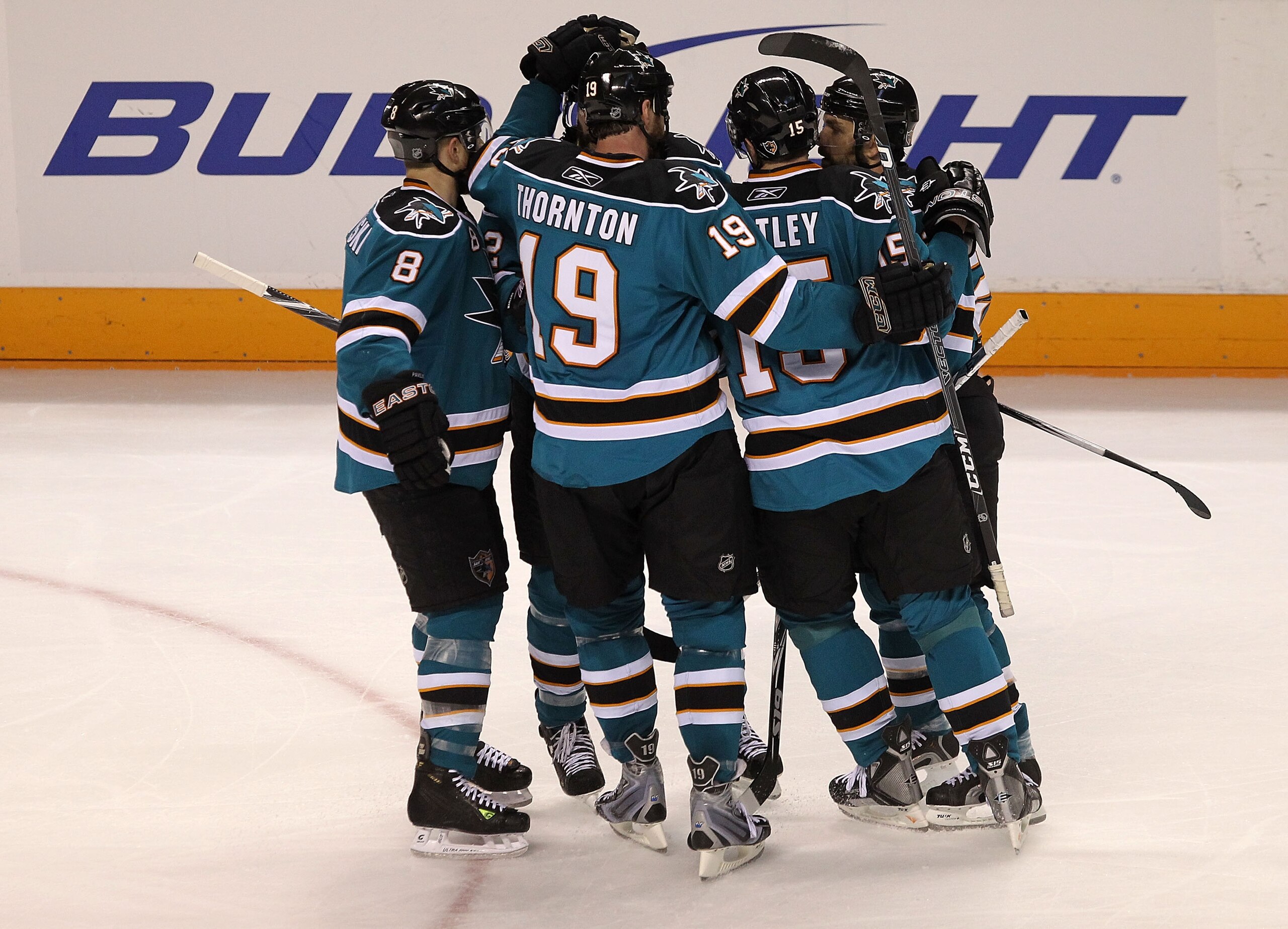 SAN JOSE, CA - MAY 18:  (R) Patrick Marleau #12 of the San Jose Sharks celebrates with his teammates after his second period goal against the Chicago Blackhawks in Game Two of the Western Conference Finals during the 2010 NHL Stanley Cup Playoffs at HP Pa