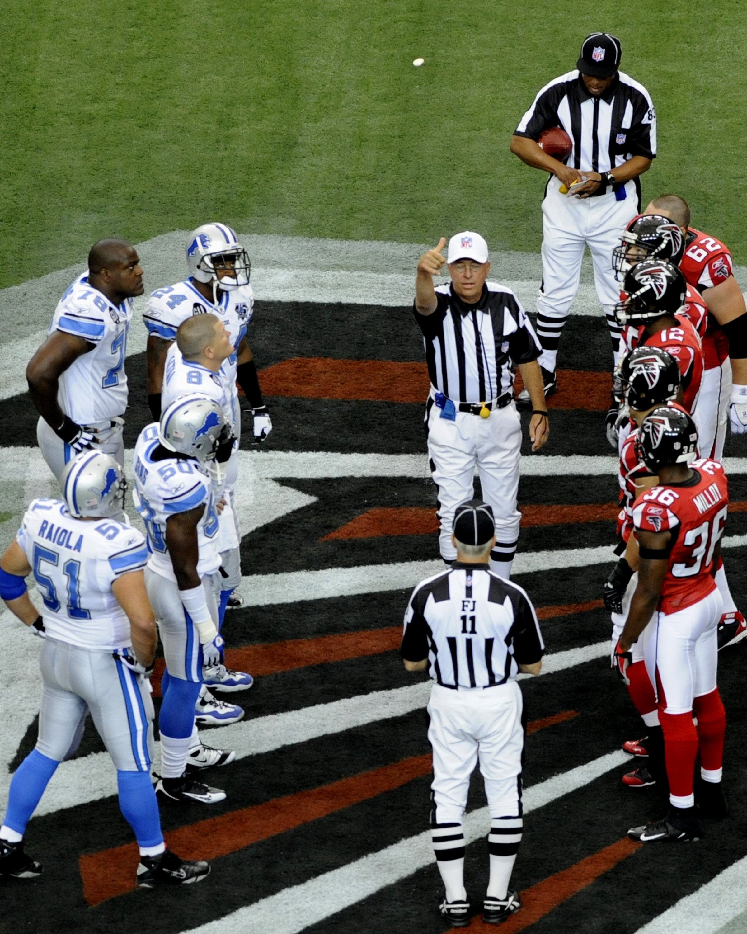 ATLANTA, GA - SEPTEMBER 7: NFL referee Ron Winter tosses the coin as the Atlanta Falcons host the Detroit Lions at the Georgia Dome on September 7, 2008 in Atlanta, Georgia.  (Photo by Al Messerschmidt/Getty Images)