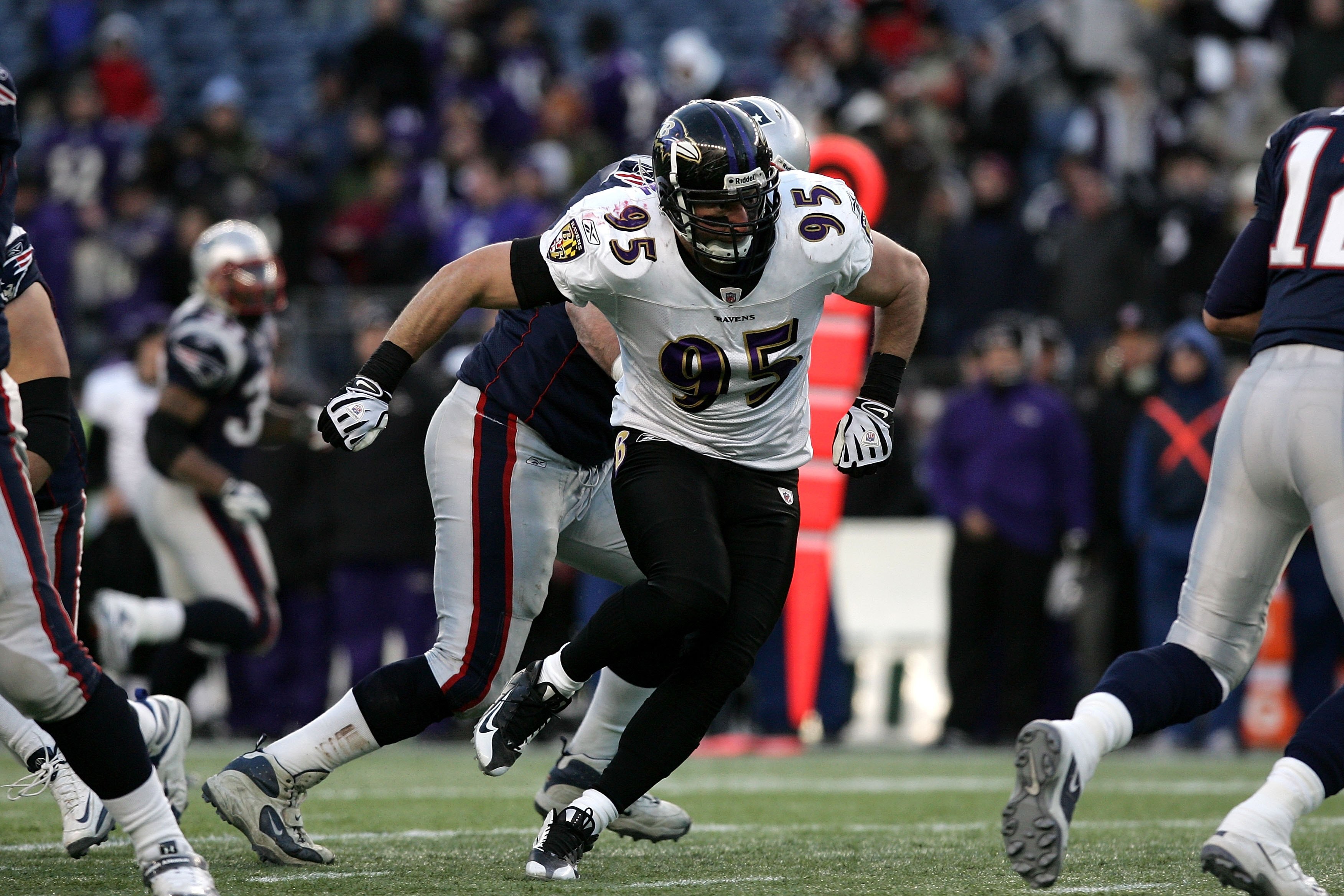 FOXBORO, MA - JANUARY 10:  Jarret Johnson #95 of the Baltimore Ravens rushes the quarterback against the New England Patriots during the 2010 AFC wild-card playoff game at Gillette Stadium on January 10, 2010 in Foxboro, Massachusetts.  (Photo by Elsa/Get