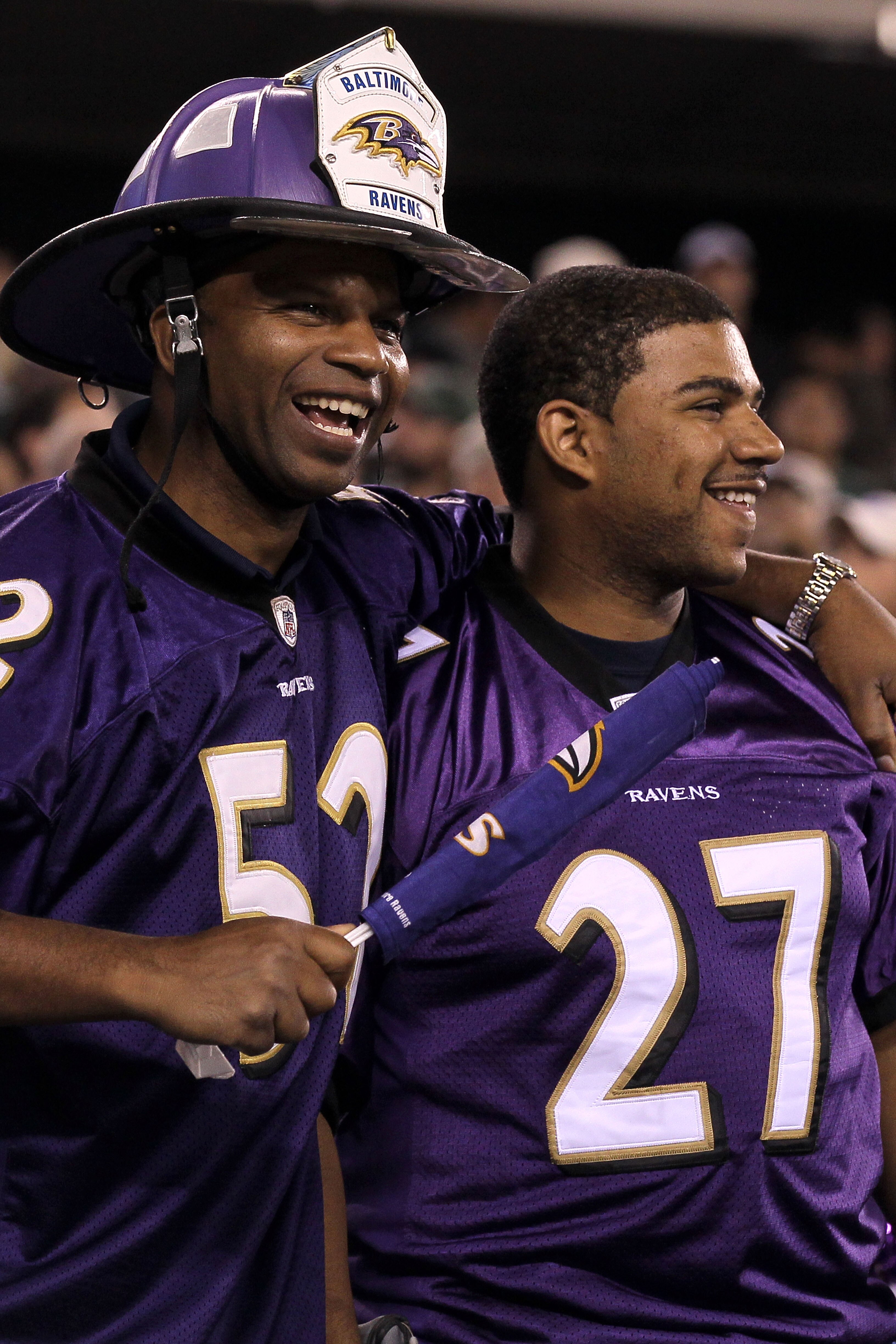 EAST RUTHERFORD, NJ - SEPTEMBER 13:  Fans of the Baltimore Ravens cheer during the game against the New York Jets at the New Meadowlands Stadium on September 13, 2010 in East Rutherford, New Jersey.  (Photo by Jim McIsaac/Getty Images)