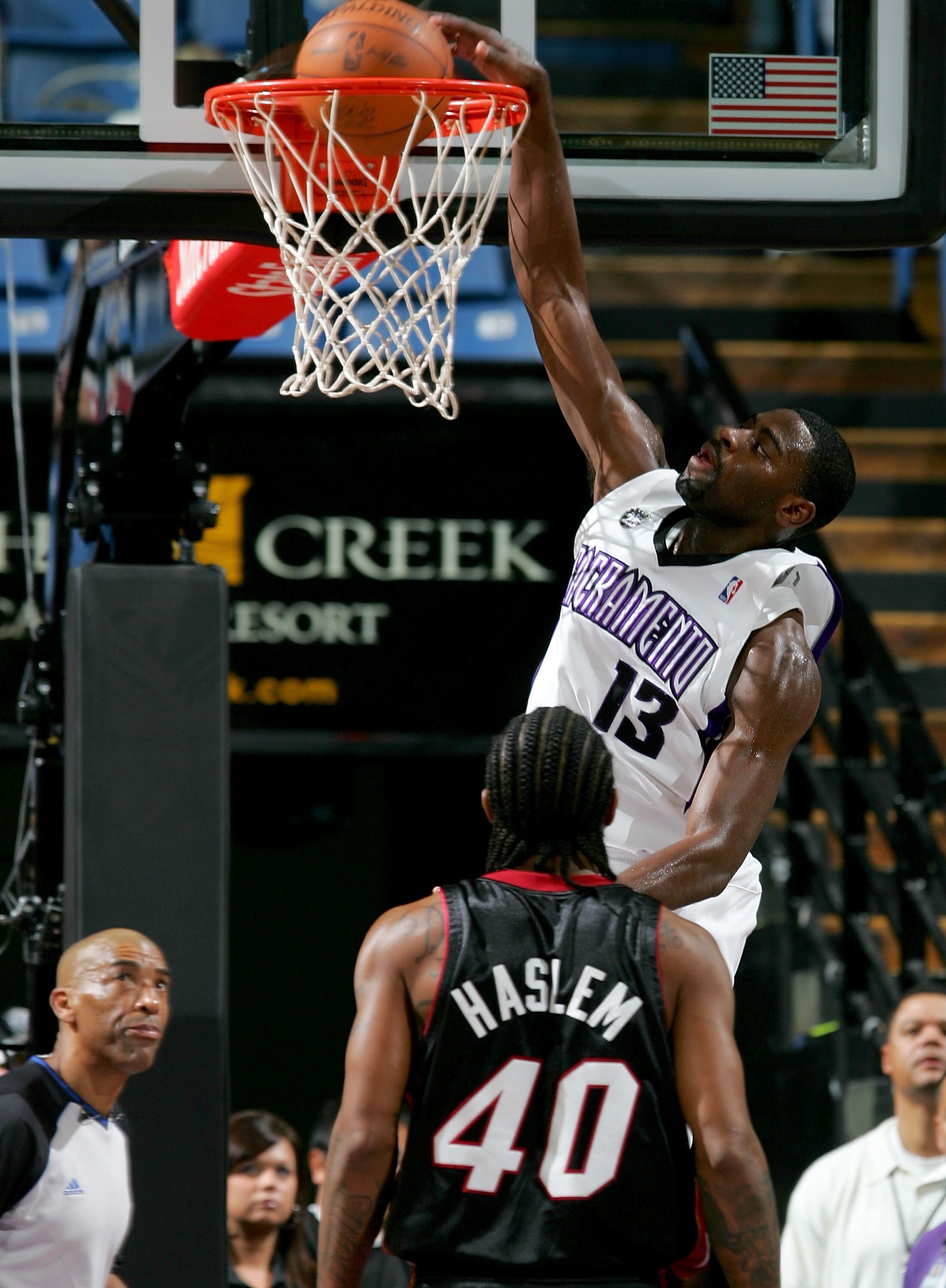 SACRAMENTO, CA - DECEMBER 06:  Tyreke Evans #13 of the Sacramento Kings dunks over Udonis Haslem #40 of the Miami Heat at ARCO Arena on December 6, 2009 in Sacramento, California.  NOTE TO USER: User expressly acknowledges and agrees that, by downloading