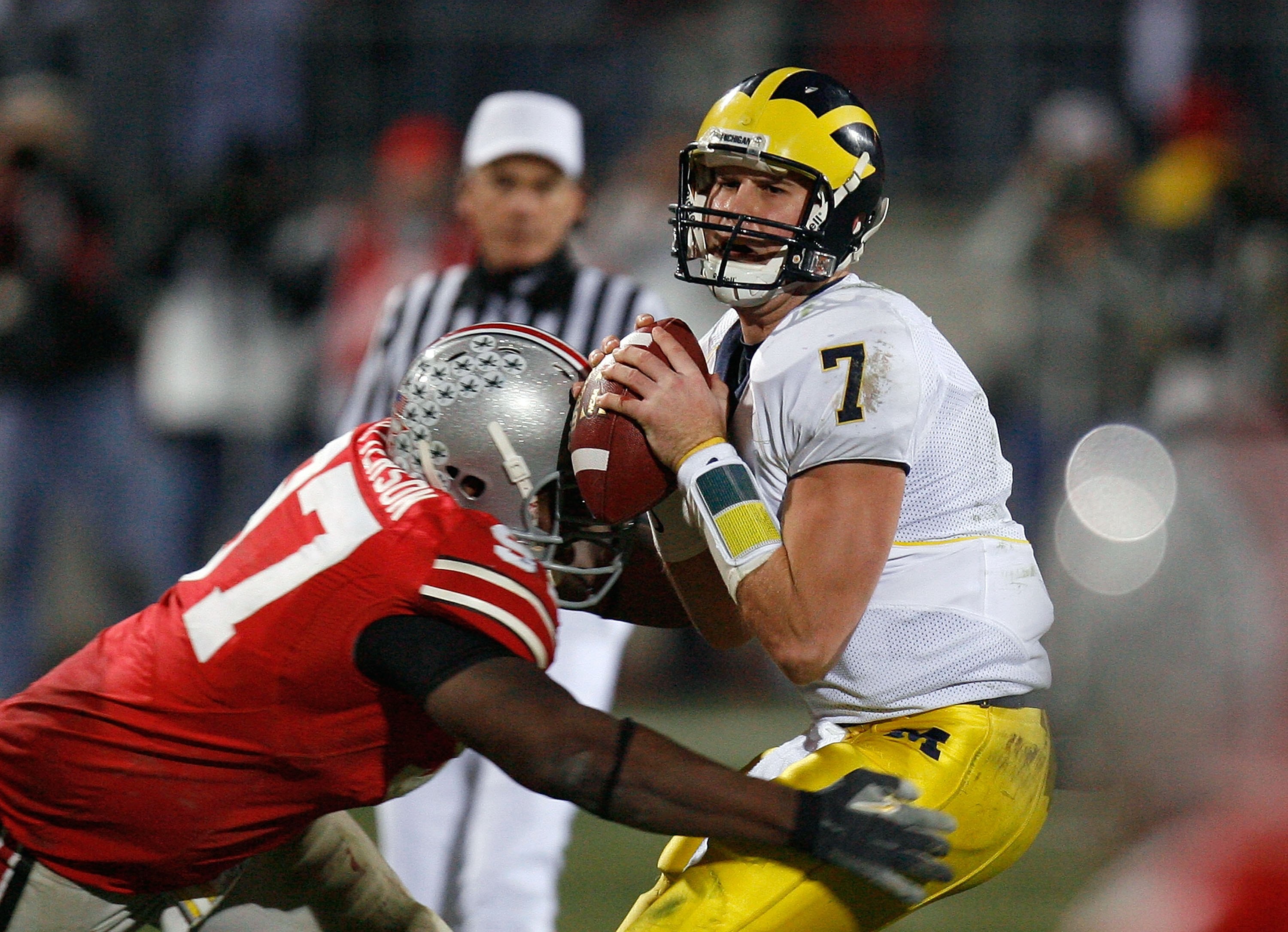COLUMBUS, OH - NOVEMBER 18:  David Patterson #97 of the Ohio State Buckeyes hits quarterback Chad Henne #7 of the Michigan Wolverines November 18, 2006 at Ohio Stadium in Columbus, Ohio. Ohio State won 42-39.  (Photo by Gregory Shamus/Getty Images)