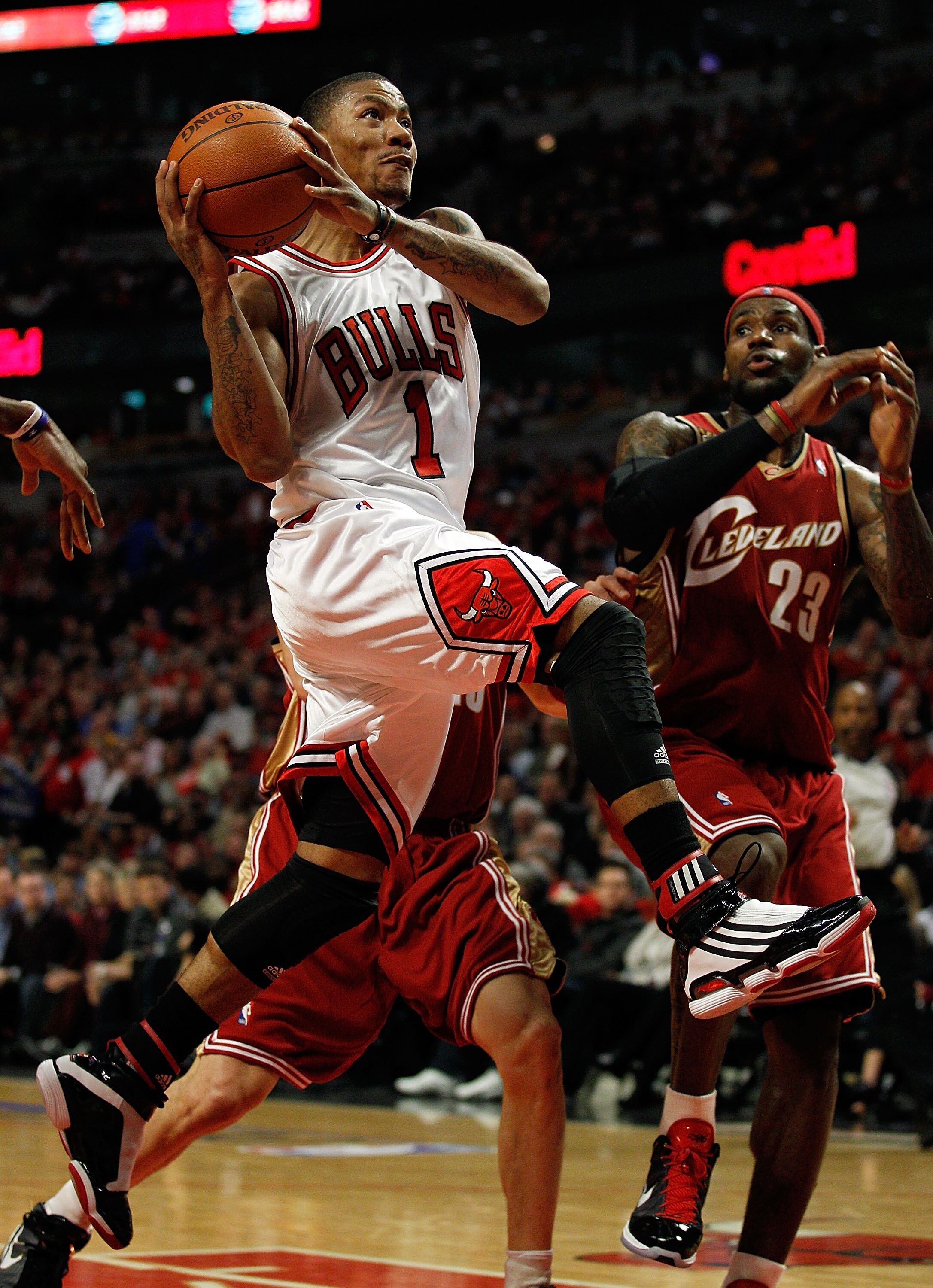 CHICAGO - APRIL 25: Derrick Rose #1 of the Chicago Bulls drives to the basket past LeBron James #23 of the Cleveland Cavaliers in Game Four of the Eastern Conference Quarterfinals during the 2010 NBA Playoffs at the United Center on April 25, 2010 in Chic
