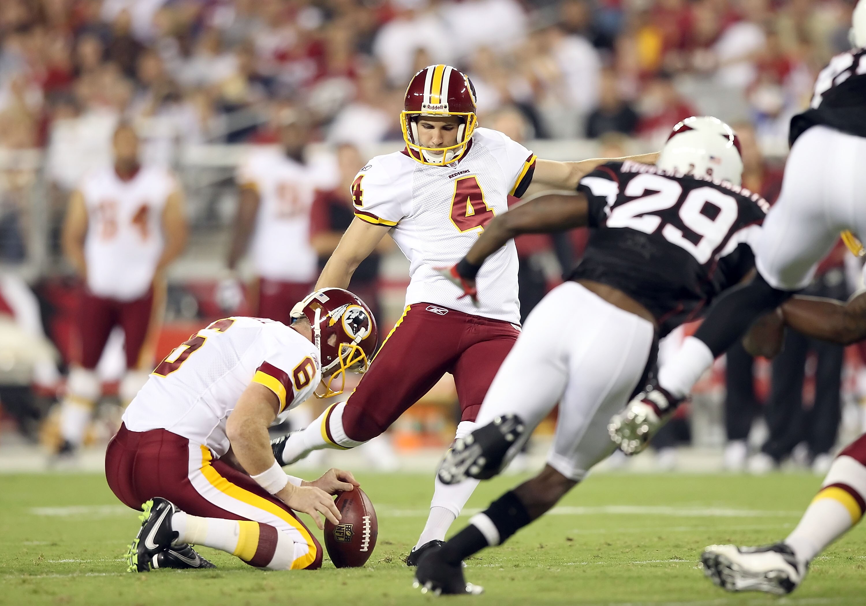 GLENDALE, AZ - SEPTEMBER 02:  Kicker Graham Gano #4 of the Washington Redskins kicks a field goal against the Arizona Cardinals during preseason NFL game at the University of Phoenix Stadium on September 2, 2010 in Glendale, Arizona. The Cardinals defeate