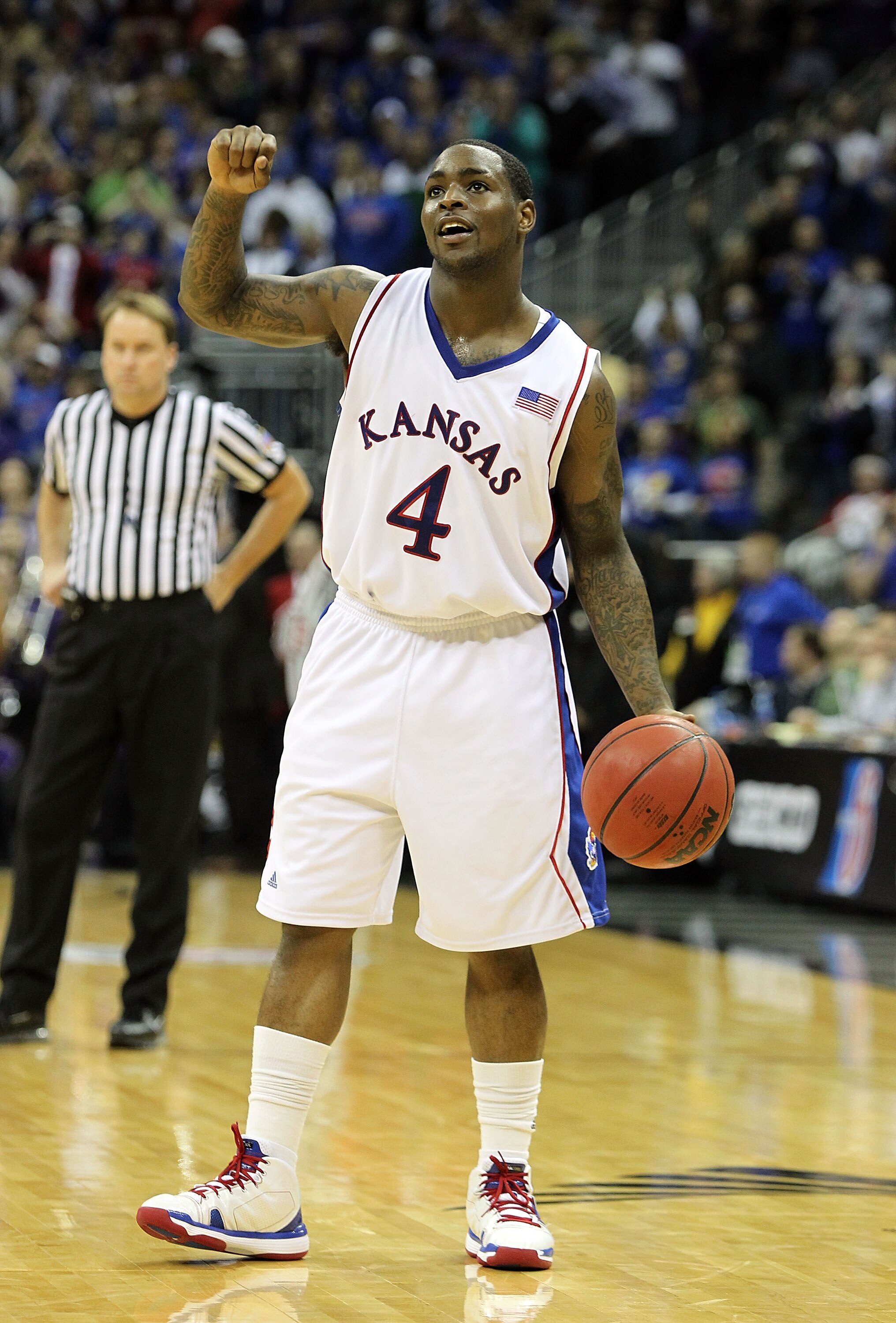 KANSAS CITY, MO - MARCH 13:  Sherron Collins #4 of the Kansas Jayhawks celebrates at the buzzer as the Jayhawks defeated the Kansas State Wildcats to win the 2010 Phillips 66 Big 12 Men's Basketball Championship on March 13, 2010 at the Sprint Center in K
