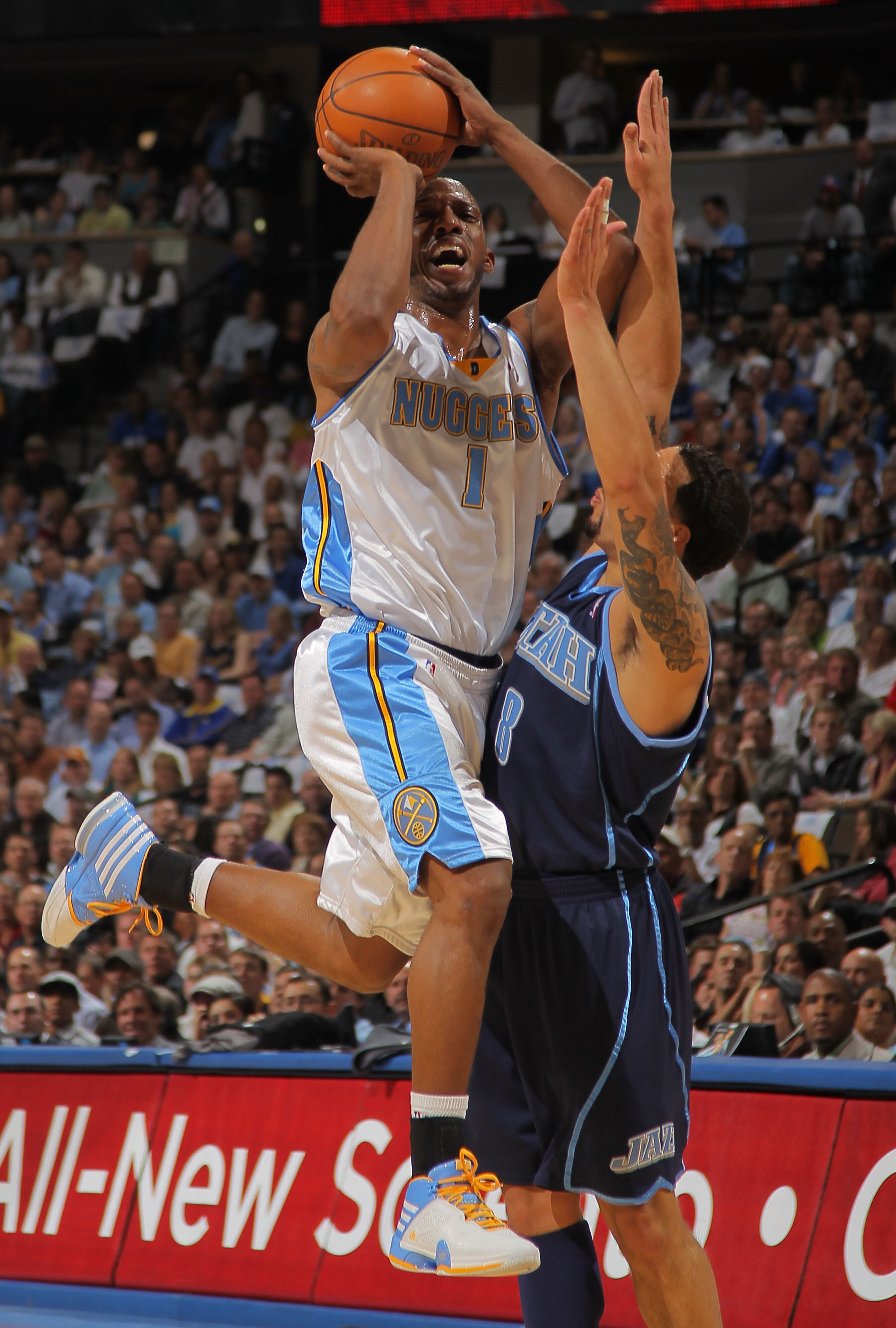 DENVER - APRIL 28:  Chauncey Billups #1 of the Denver Nuggets against the defense of Deron Williams #8 of the Utah Jazz  in Game Five of the Western Conference Quarterfinals of the 2010 NBA Playoffs at the Pepsi Center on April 28, 2010 in Denver, Colorad