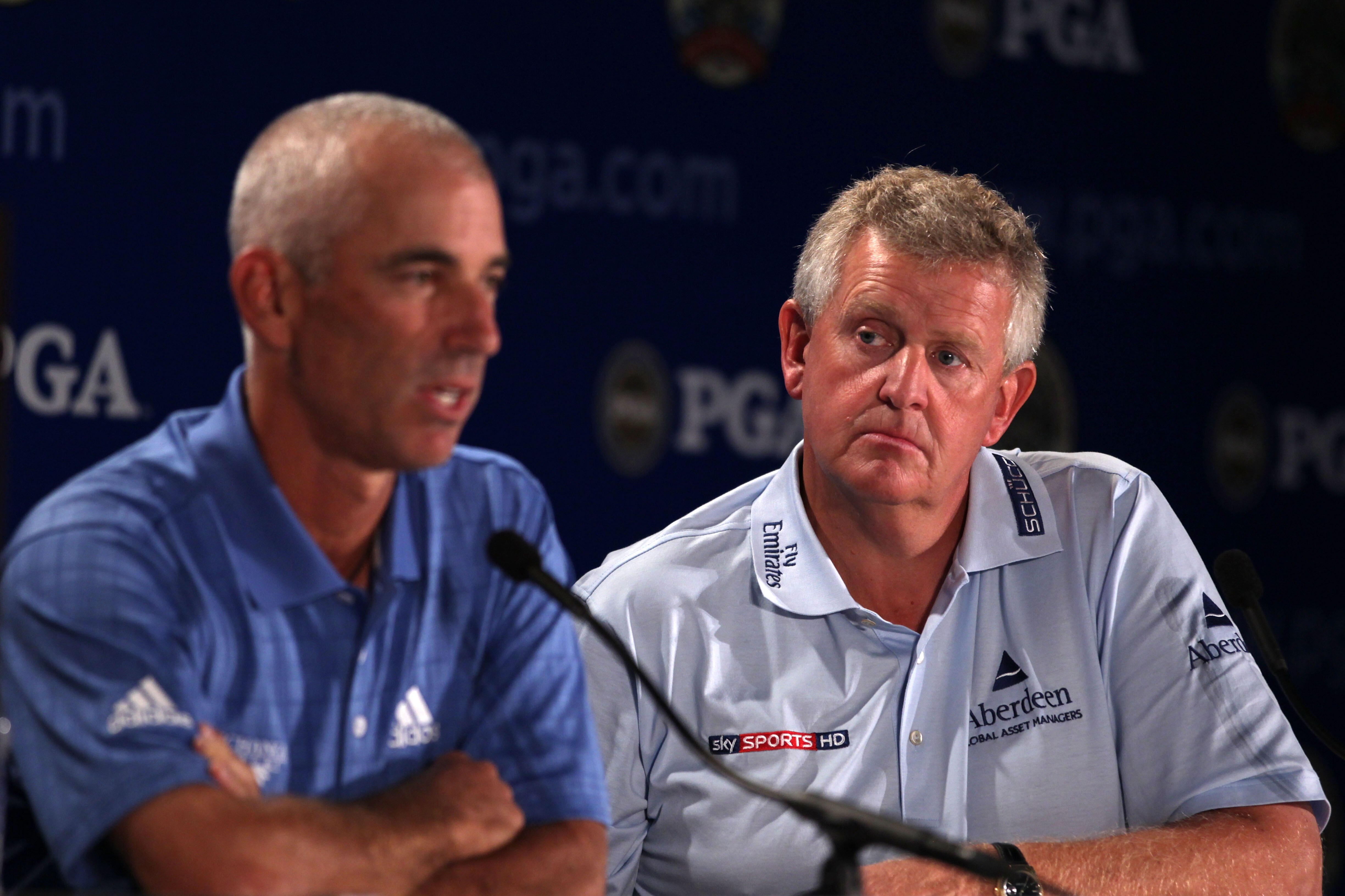 KOHLER, WI - AUGUST 11:  Colin Montgomerie of Scotland (R), European Ryder Cup Captain, looks on as Corey Pavin, United States Ryder Cup Captain, speaks to the media during a press conference prior to the start of the 92nd PGA Championship on the Straits