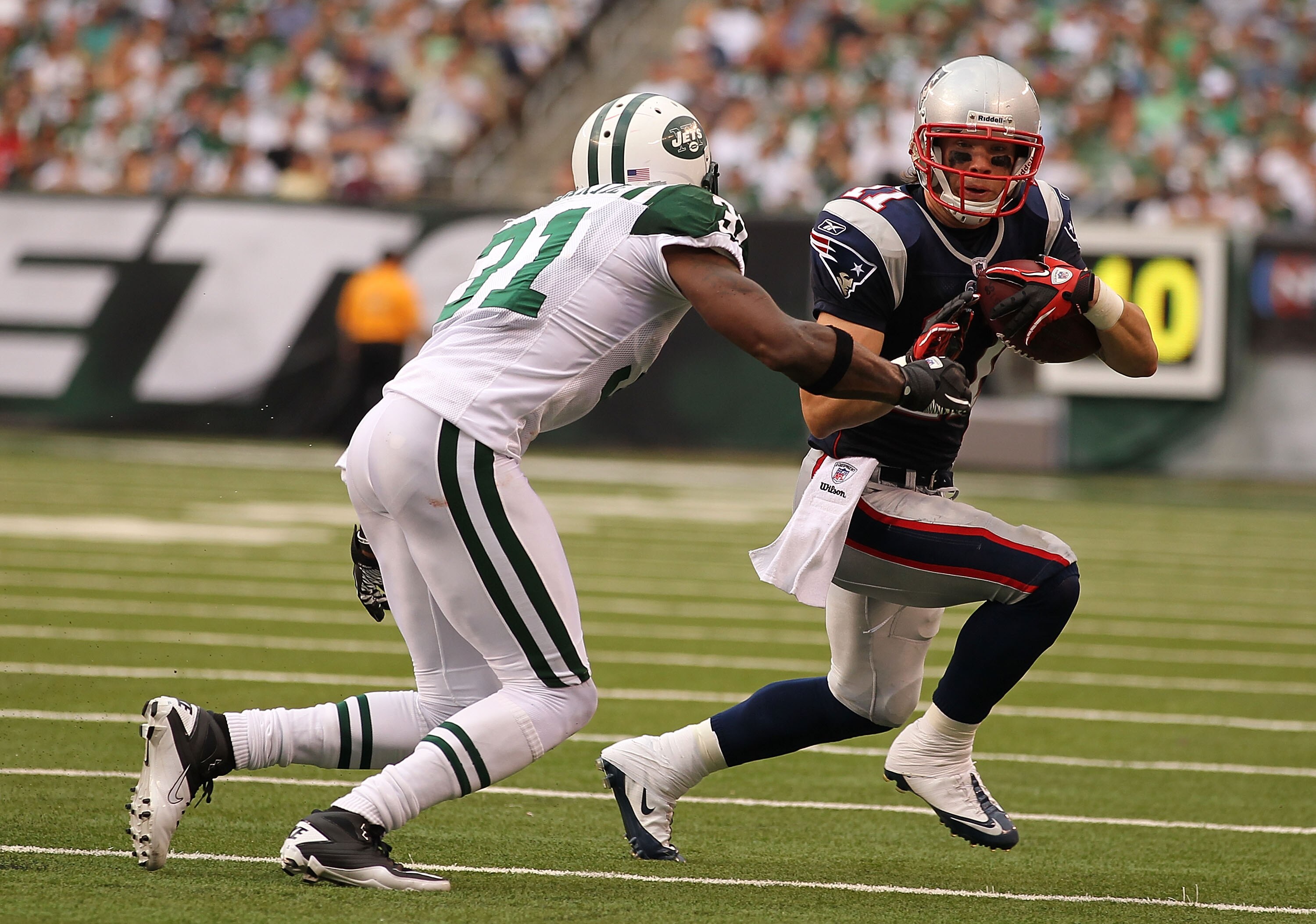 EAST RUTHERFORD, NJ - SEPTEMBER 19: Antonio Cromartie #31 of the New York Jets tackles Julian Edelman #11 of the New England Patriots during their game on September 19, 2010 at the New Meadowlands Stadium in East Rutherford, New Jersey. (Photo by Al B EAST RUTHERFORD, NJ - SEPTEMBER 19: Antonio Cromartie #31 of the New York Jets tackles Julian Edelman #11 of the New England Patriots during their game on September 19, 2010 at the New Meadowlands Stadium in East Rutherford, New Jersey. (Photo by Al B