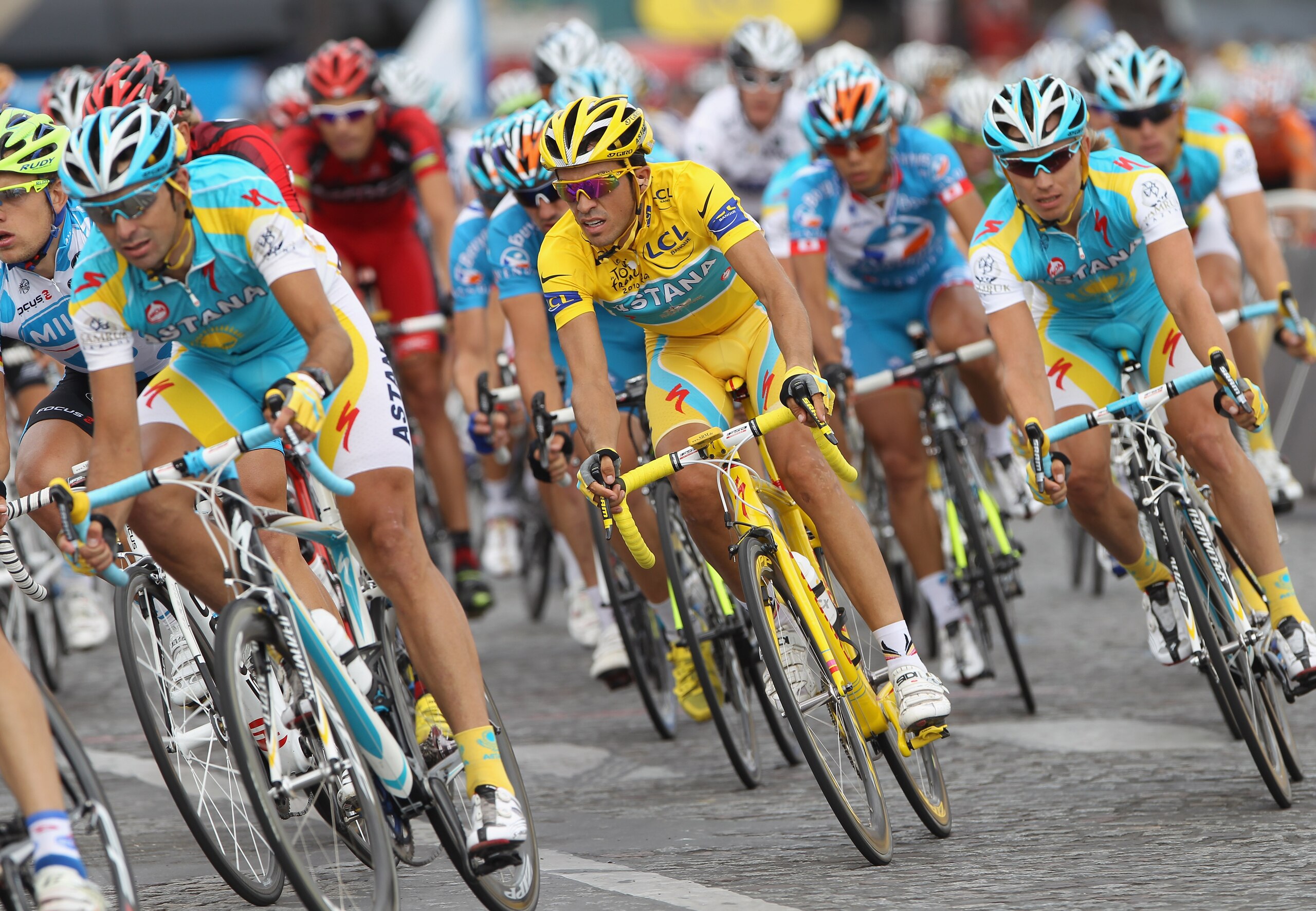 PARIS - JULY 25:  Alberto Contador (C) of team Astana races amongst teammates during the twentieth and final stage of Le Tour de France 2010, from Longjumeau to the Champs-Elysees in Paris on July 25, 2010 in Paris, France.  (Photo by Bryn Lennon/Getty Im