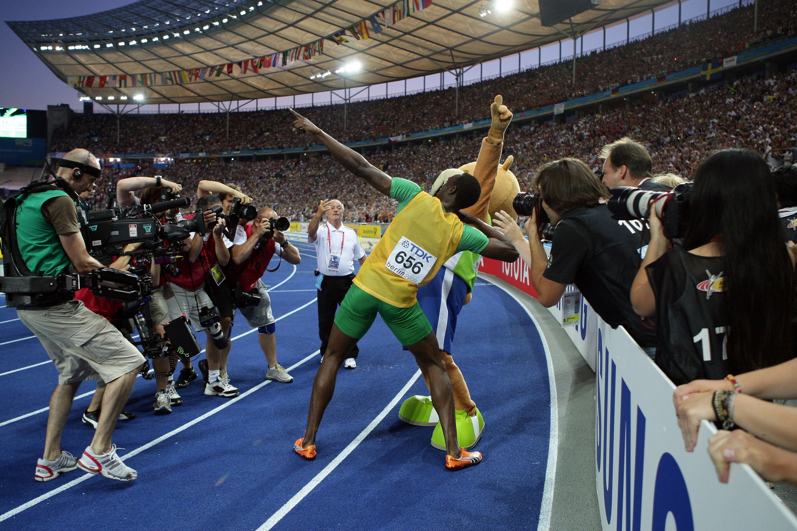 BERLIN - AUGUST 20:  Usain Bolt of Jamaica celebrates winning the gold medal in the men's 200 Metres Final during day six of the 12th IAAF World Athletics Championships at the Olympic Stadium on August 20, 2009 in Berlin, Germany.  Bolt set a new World Re