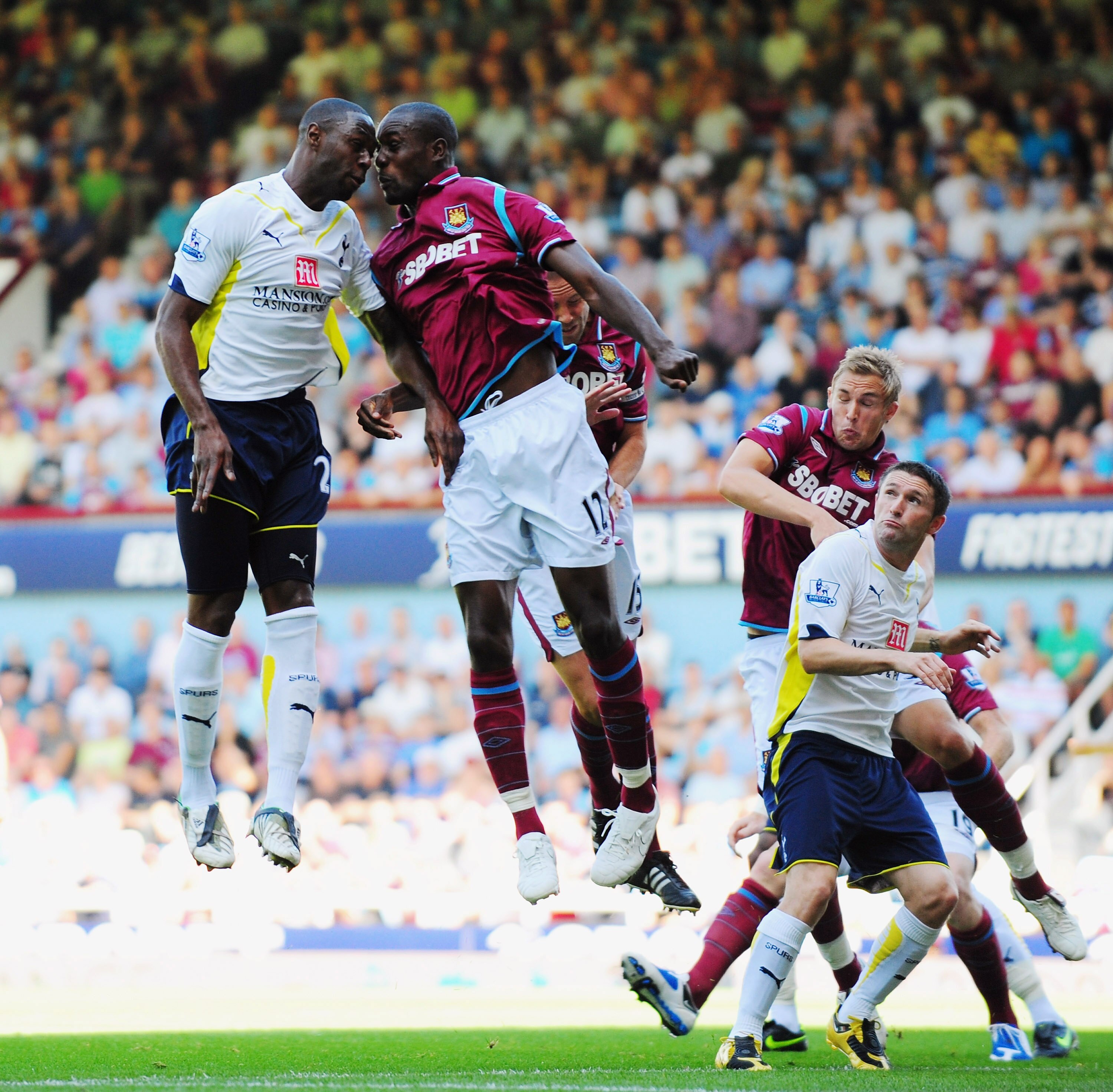 LONDON, ENGLAND - AUGUST 23:  Ledley King of Tottenham (L) clashes with Carlton Cole of West Ham during the Barclays Premier League match between West Ham United and Tottenham Hotspur on August 23, 2009 in London, England.  (Photo by Mike Hewitt/Getty Ima