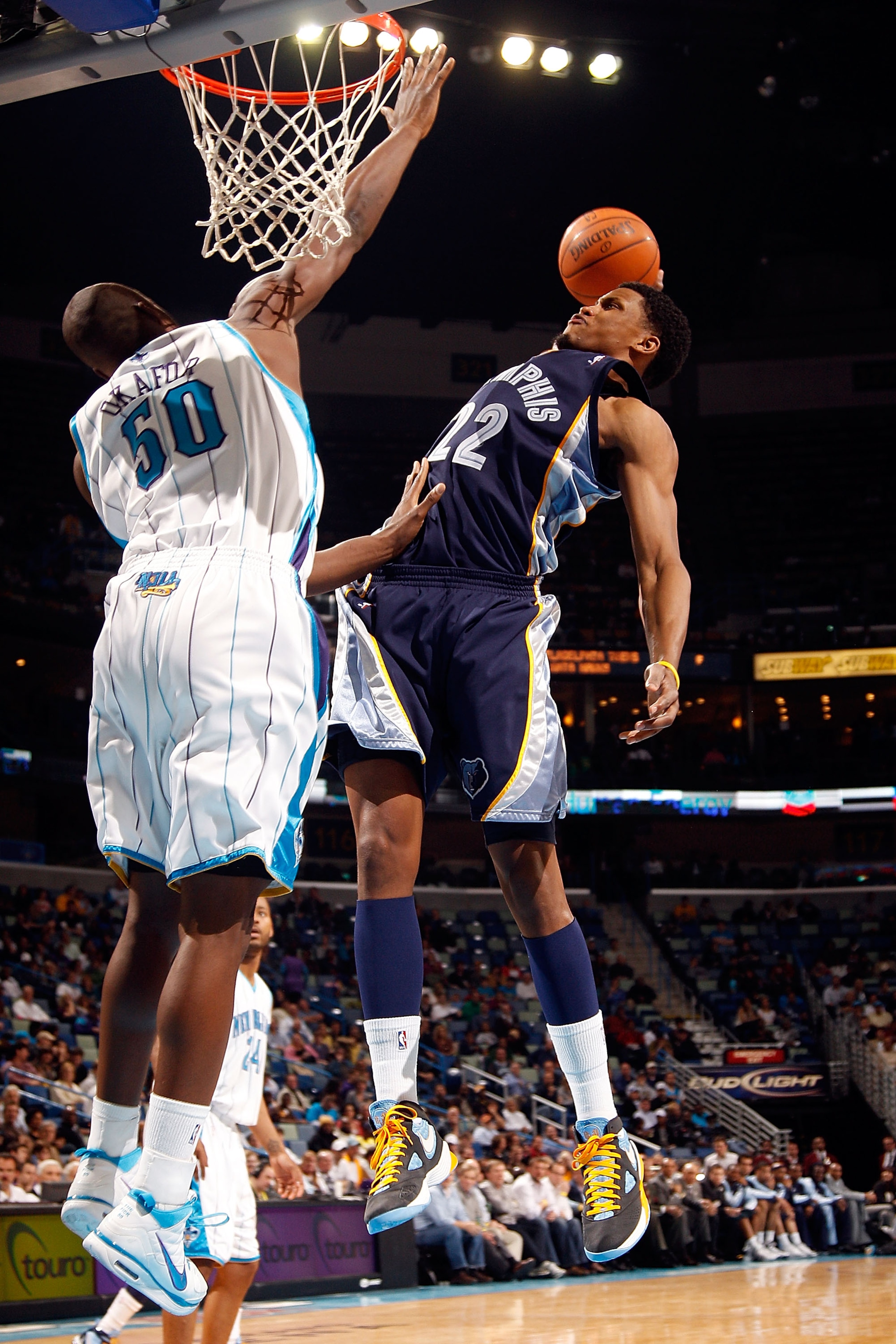 NEW ORLEANS - MARCH 03:  Rudy Gay #22 of the Memphis Grizzlies dunks the ball over Emeka Okafor #50 of the New Orleans Hornets at the New Orleans Arena on March 3, 2010 in New Orleans, Louisiana.  The Grizzlies defeated the Hornets 104-100.  NOTE TO USER: