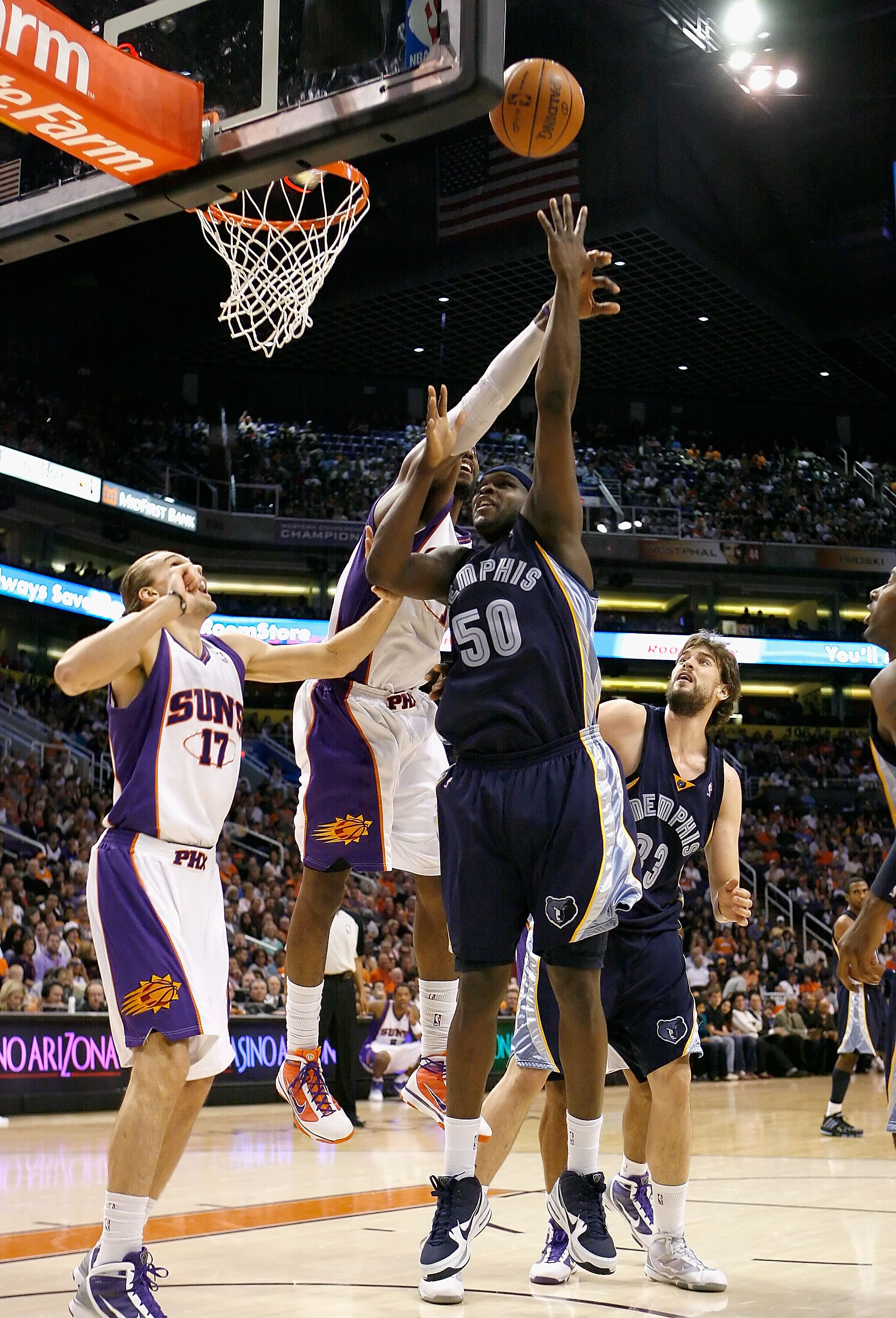 PHOENIX - NOVEMBER 25:  Zach Randolph #50 of the Memphis Grizzlies puts up a shot over Louis Amundson #17 of the Phoenix Suns during the NBA game at US Airways Center on November 25, 2009 in Phoenix, Arizona.  The Suns defeated the Grizzlies 126-111.  NOT