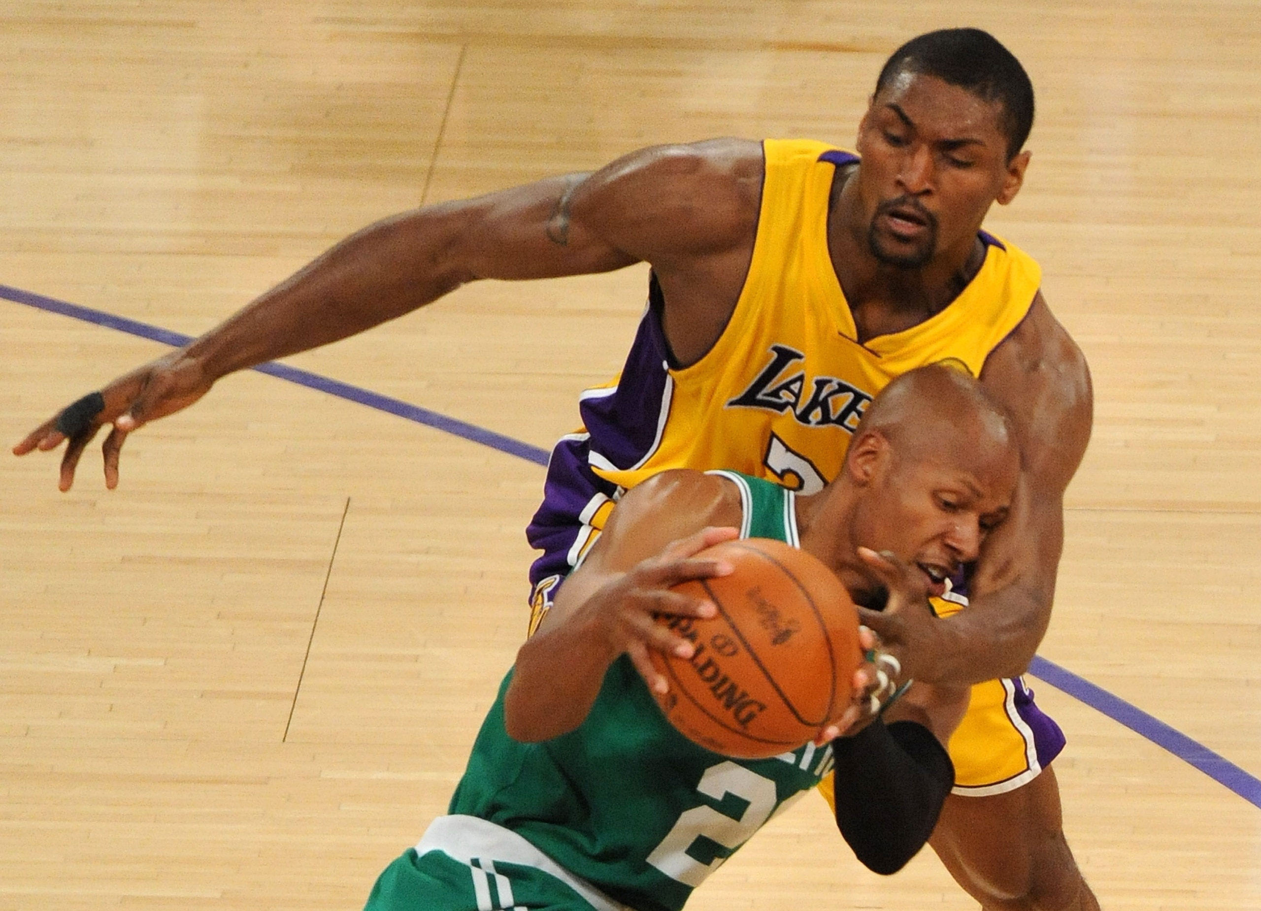 LOS ANGELES, CA - JUNE 17:  Ray Allen #20 of the Boston Celtics looks to move the ball as he is covered by Ron Artest #37 of the Los Angeles Lakers in the first quarter of Game Seven of the 2010 NBA Finals at Staples Center on June 17, 2010 in Los Angeles