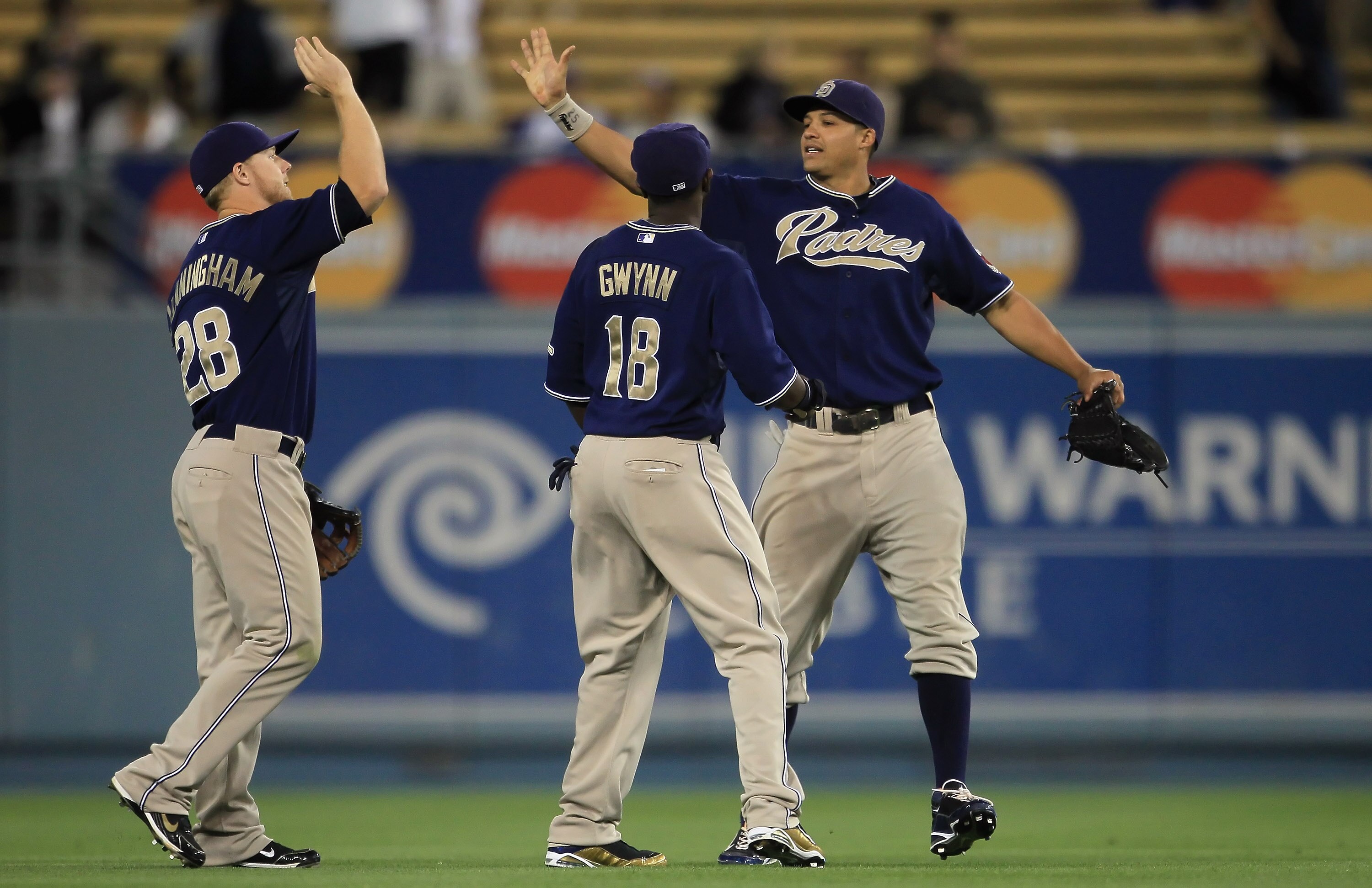 LOS ANGELES, CA - SEPTEMBER 22:  (L-R) Aaron Cunningham #28, Tony Gwynn #18 and Will Venable #25 of the San Diego Padres celebrate their teams victory over the Los Angeles Dodgers at Dodger Stadium on September 22, 2010 in Los Angeles, California. The Pad