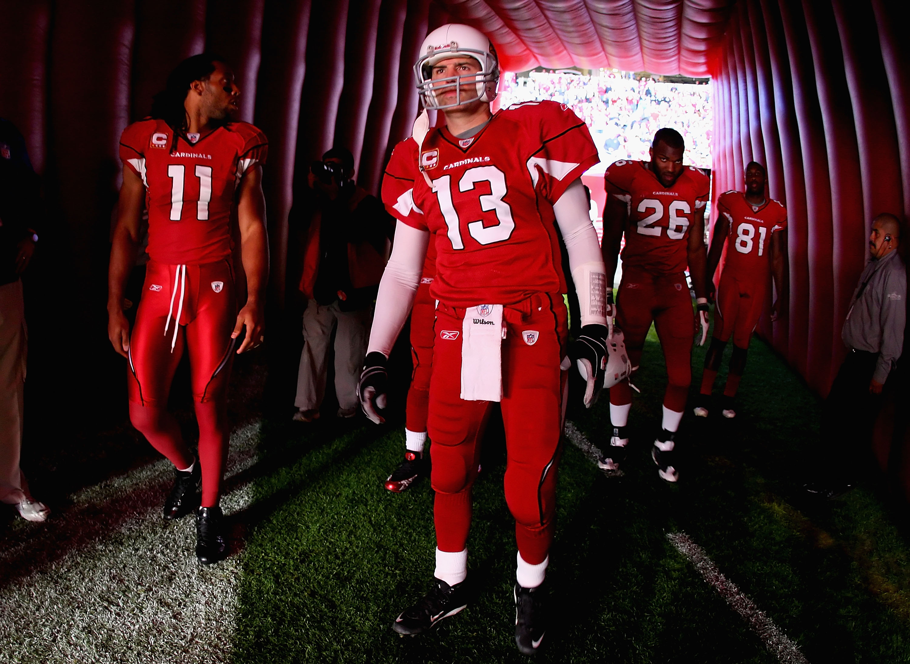 GLENDALE, AZ - DECEMBER 27:  (L-R) Larry Fitzgerald #11, Kurt Warner #13, Beanie Wells #26 and Anquan Boldin #81 of the Arizona Cardinals prepare to take the field before the NFL game against the St. Louis Rams at the Universtity of Phoenix Stadium on Dec