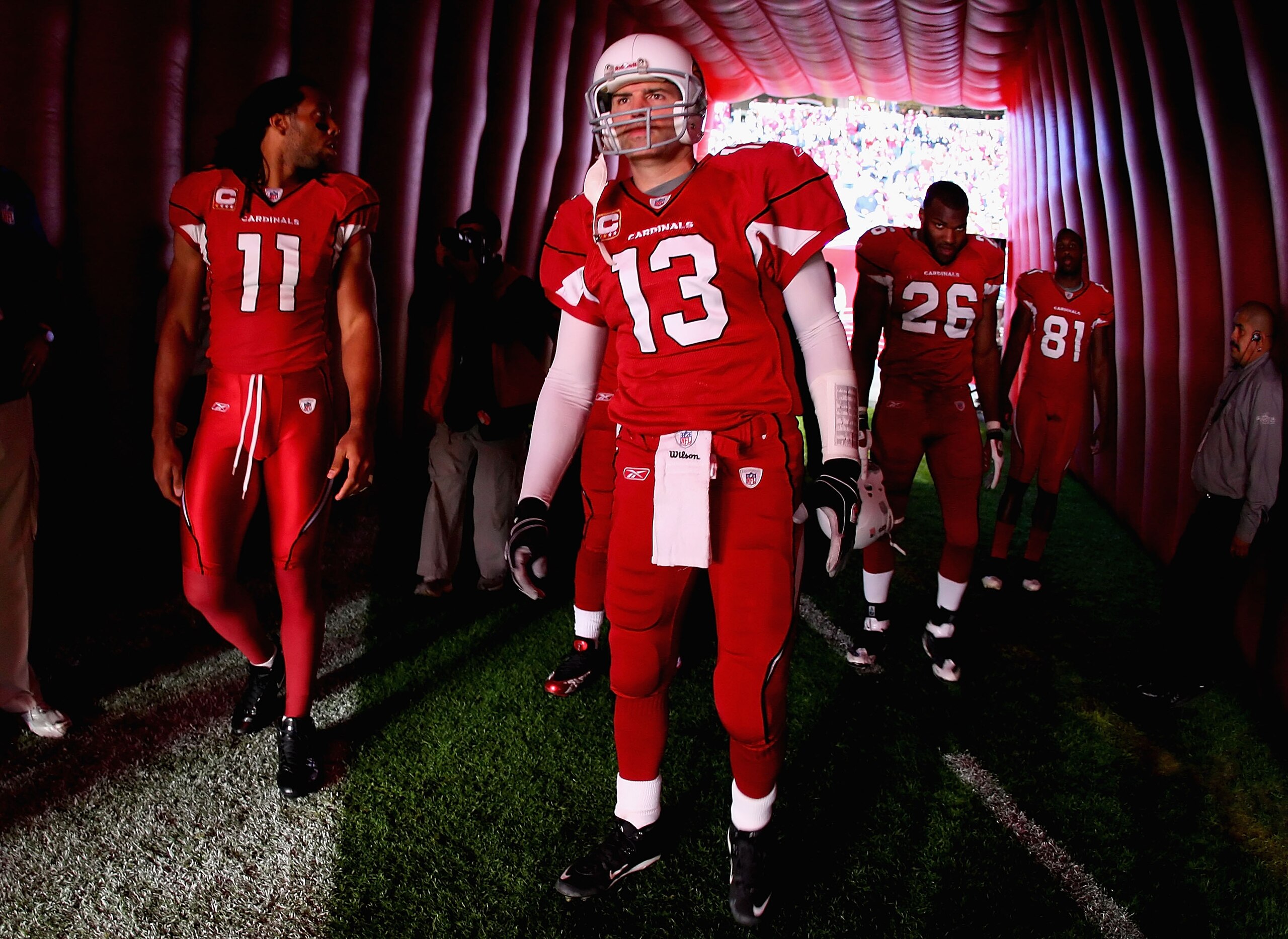 GLENDALE, AZ - DECEMBER 27:  (L-R) Larry Fitzgerald #11, Kurt Warner #13, Beanie Wells #26 and Anquan Boldin #81 of the Arizona Cardinals prepare to take the field before the NFL game against the St. Louis Rams at the Universtity of Phoenix Stadium on Dec