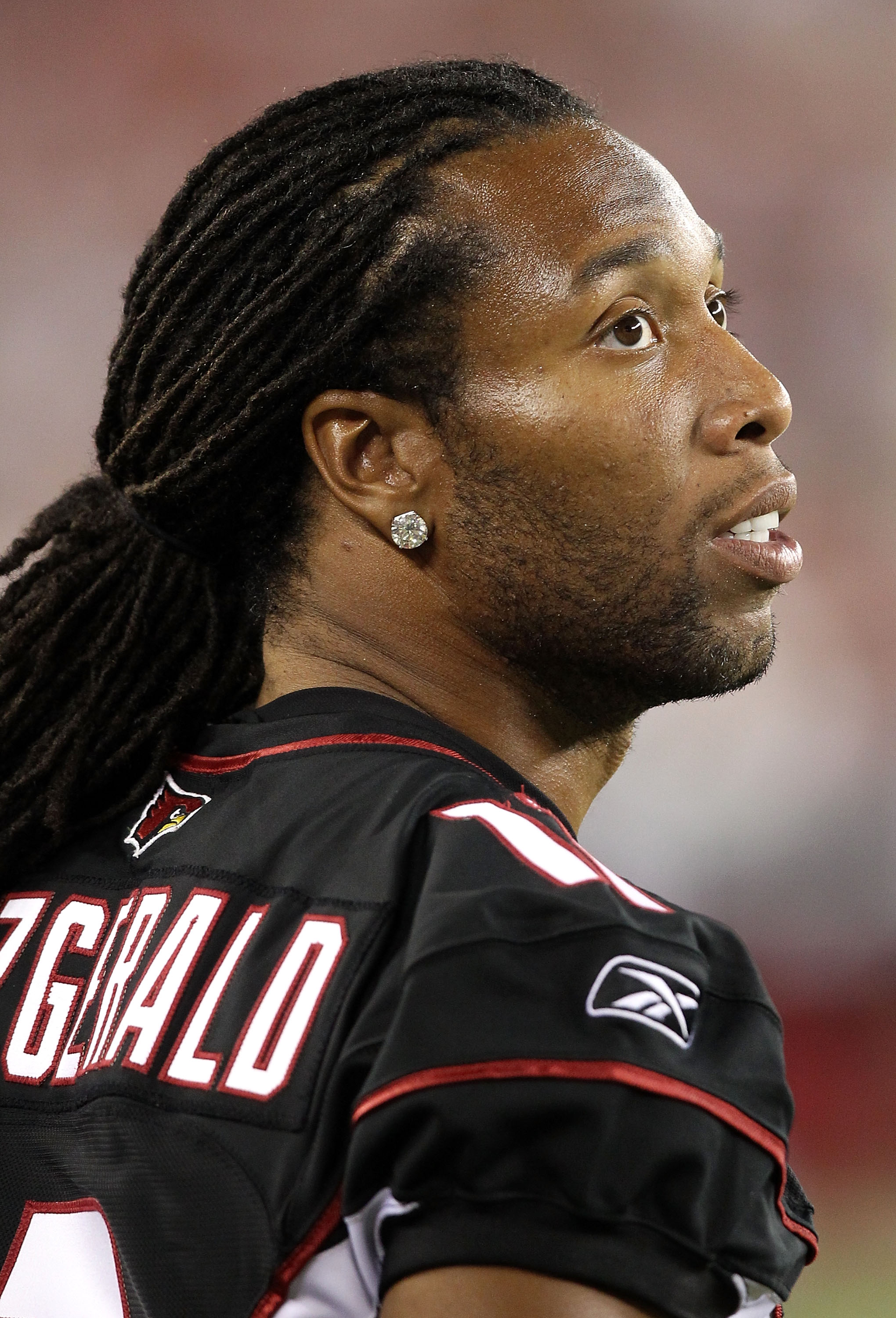 GLENDALE, AZ - SEPTEMBER 02:  Wide receiver Larry Fitzgerald #11 of the Arizona Cardinals stands on the sidelines during the preseason NFL game against the Washington Redskins at the University of Phoenix Stadium on September 2, 2010 in Glendale, Arizona.
