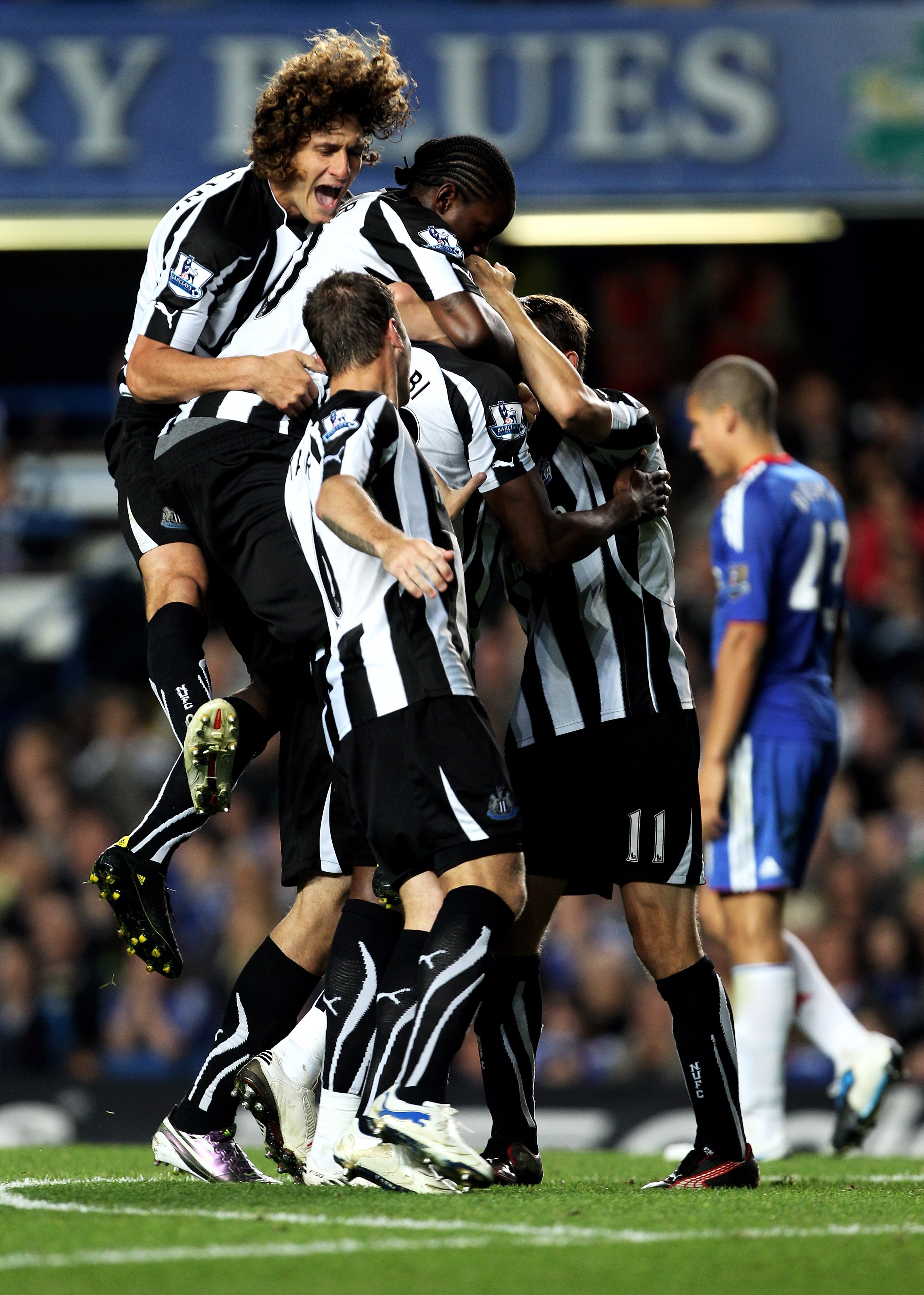 LONDON, ENGLAND - SEPTEMBER 22:  Shola Ameobi (obscured) of Newcastle is congratulated by teammates after scoring his team's third goal during the Carling Cup third round match between Chelsea and Newcastle United at Stamford Bridge on September 22, 2010 