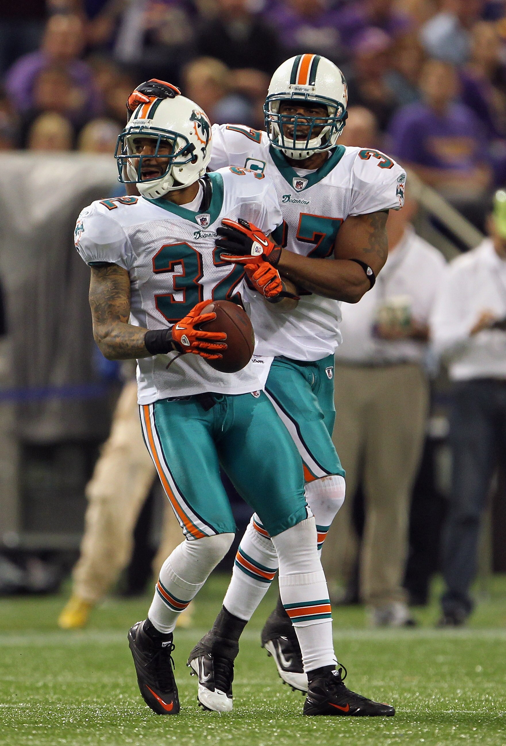 MINNEAPOLIS - SEPTEMBER 19: Jason Allen #32 of the Miami Dolphins is congratulated by Yeremiah Bell #37 after an interception during the game on September 19, 2010 at Hubert H. Humphrey Metrodome in Minneapolis, Minnesota. (Photo by Jamie Squire/Getty I MINNEAPOLIS - SEPTEMBER 19: Jason Allen #32 of the Miami Dolphins is congratulated by Yeremiah Bell #37 after an interception during the game on September 19, 2010 at Hubert H. Humphrey Metrodome in Minneapolis, Minnesota. (Photo by Jamie Squire/Getty I