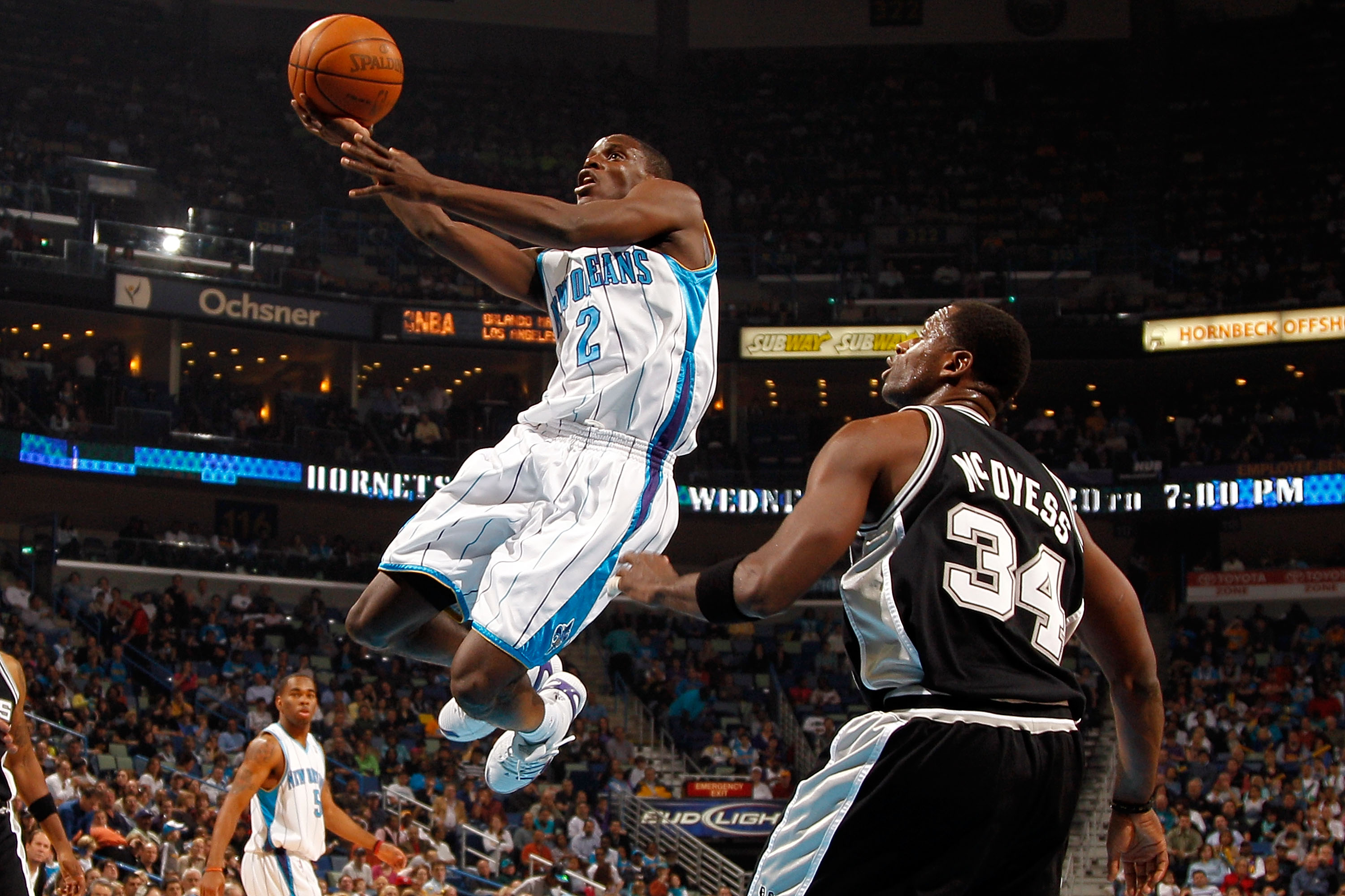 NEW ORLEANS - JANUARY 18:  Darren Collison #2 of the New Orleans Hornets makes a layup over Antonio McDyess #34 of the San Antonio Spurs at New Orleans Arena on January 18, 2010 in New Orleans, Louisiana.   NOTE TO USER: User expressly acknowledges and ag
