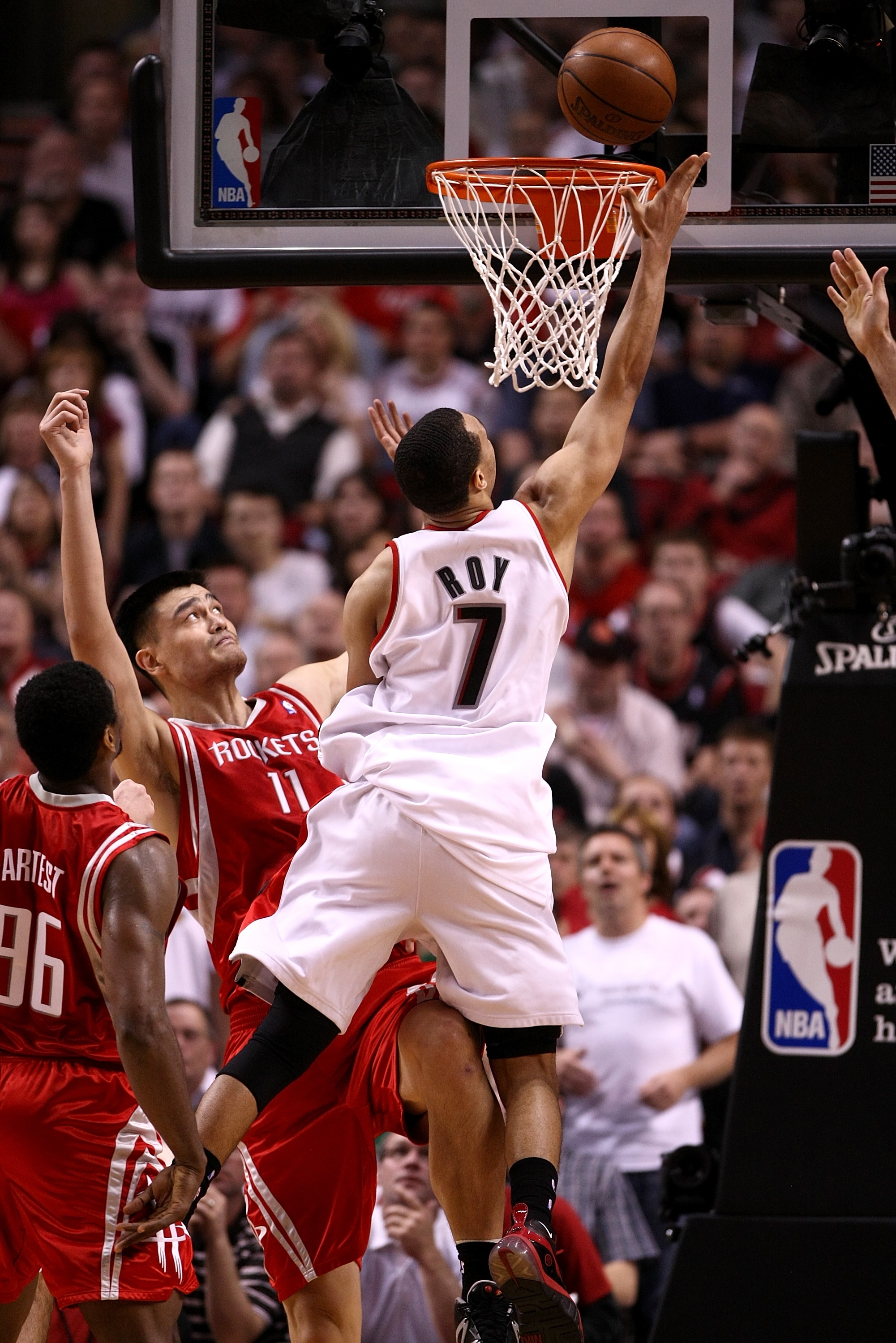 PORTLAND, OR - APRIL 21:  Brandon Roy #7 of the Portland Trail Blazers drives against Yao Ming #11 of the Houston Rockets during Game 2 of the Western Conference Quarterfinals of the NBA Playoffs on April 21, 2009 at the Rose Garden in Portland, Oregon. N