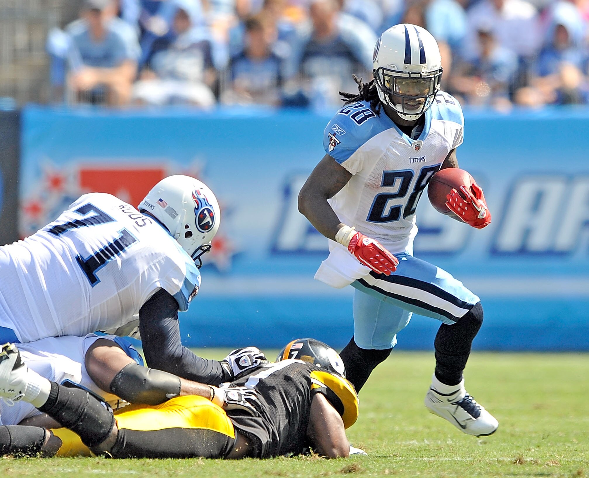 NASHVILLE, TN - SEPTEMBER 19:  Lawrence Timmons #94 of the Pittsburgh Steelers tackles Chris Johnson #28 of the Tennessee Titans at LP Field on September 19, 2010 in Nashville, Tennessee. The Steelers won 19-11.  (Photo by Grant Halverson/Getty Images)