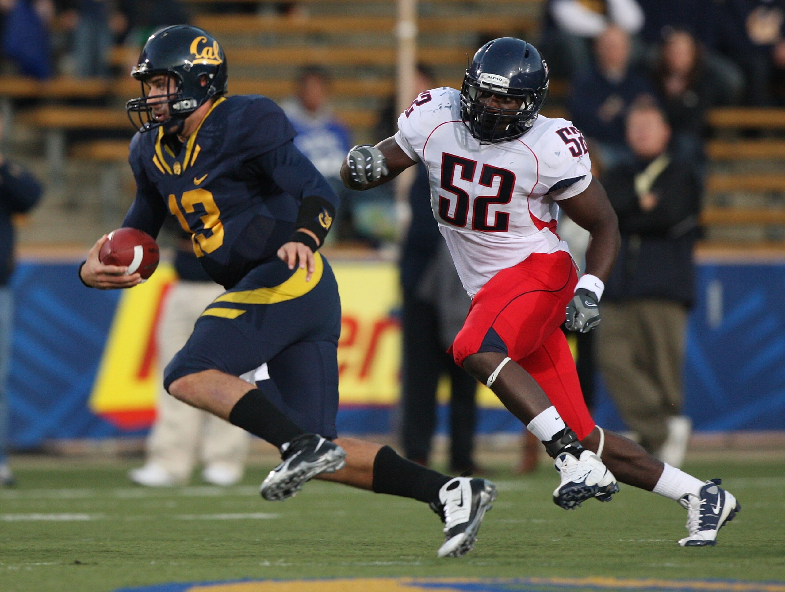 BERKELEY, CA - NOVEMBER 14: Kevin Riley #13 of the California Golden Bears runs against Sterling Lewis #52 of the Arizona Wildcats at California Memorial Stadium on November 14, 2009 in Berkeley, California. (Photo by Jed Jacobsohn/Getty Images)