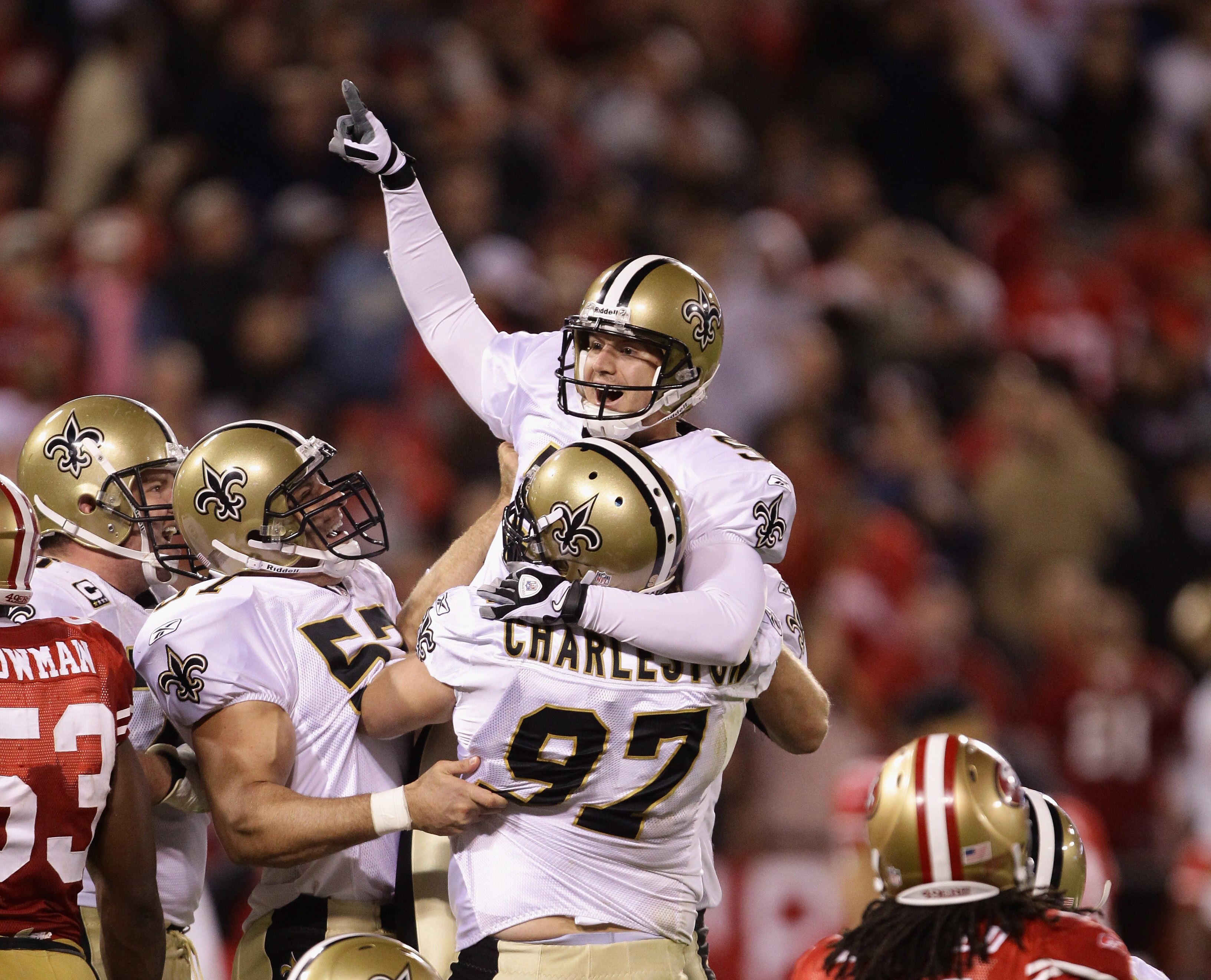 SAN FRANCISCO - SEPTEMBER 20:  Garrett Hartley #5 of the New Orleans Saints is lifted in the air by Jeff Charleston #97 after Hartley kicked the game winning field goal against the San Francisco 49ers at Candlestick Park on September 20, 2010 in San Franc