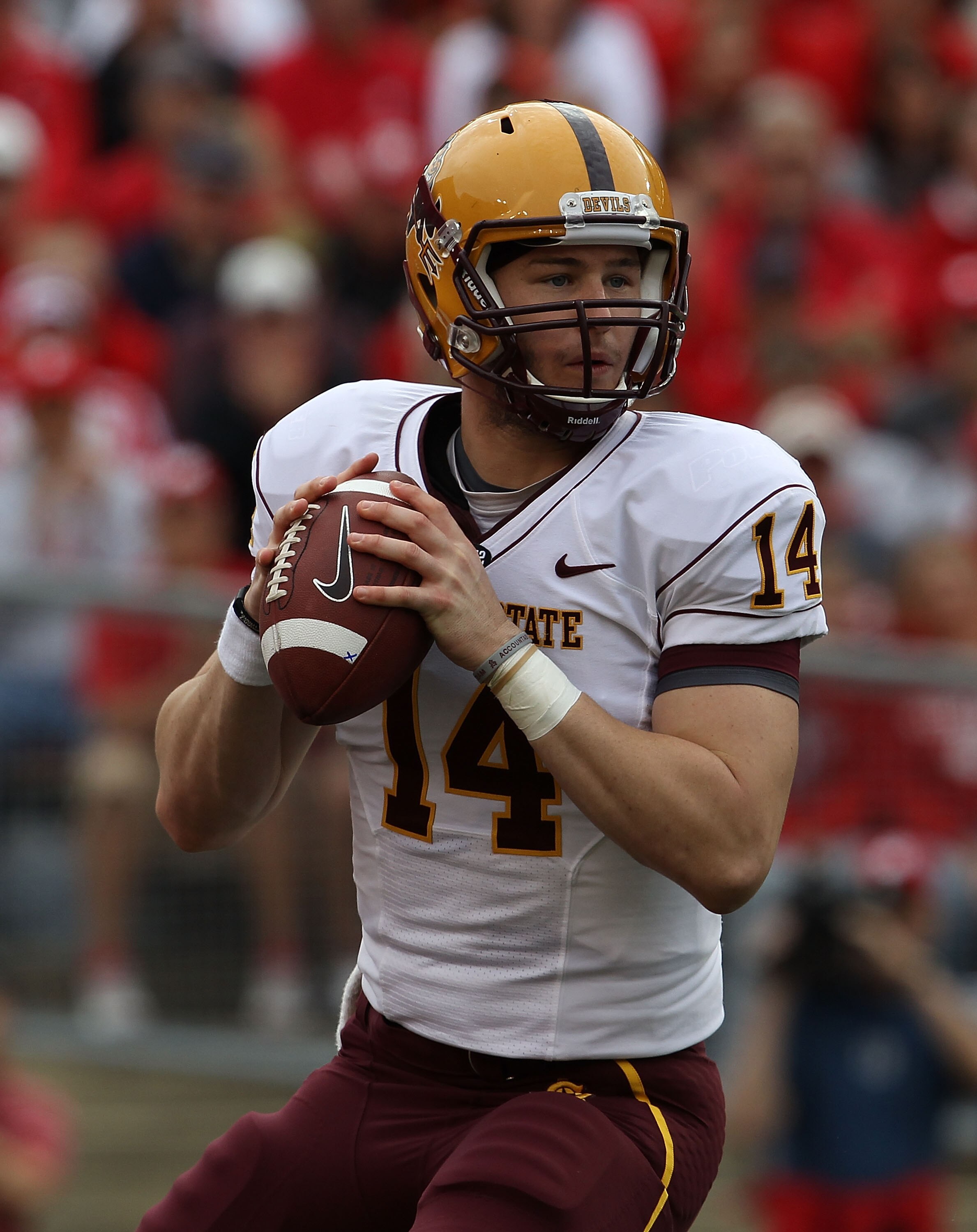 MADISON, WI - SEPTEMBER 18: Steven Threet #14 of the Arizona State Sun Devils looks for a receiver against the Wisconsin Badgers at Camp Randall Stadium on September 18, 2010 in Madison, Wisconsin. Wisconsin defeated Arizona State 20-19.  (Photo by Jonath