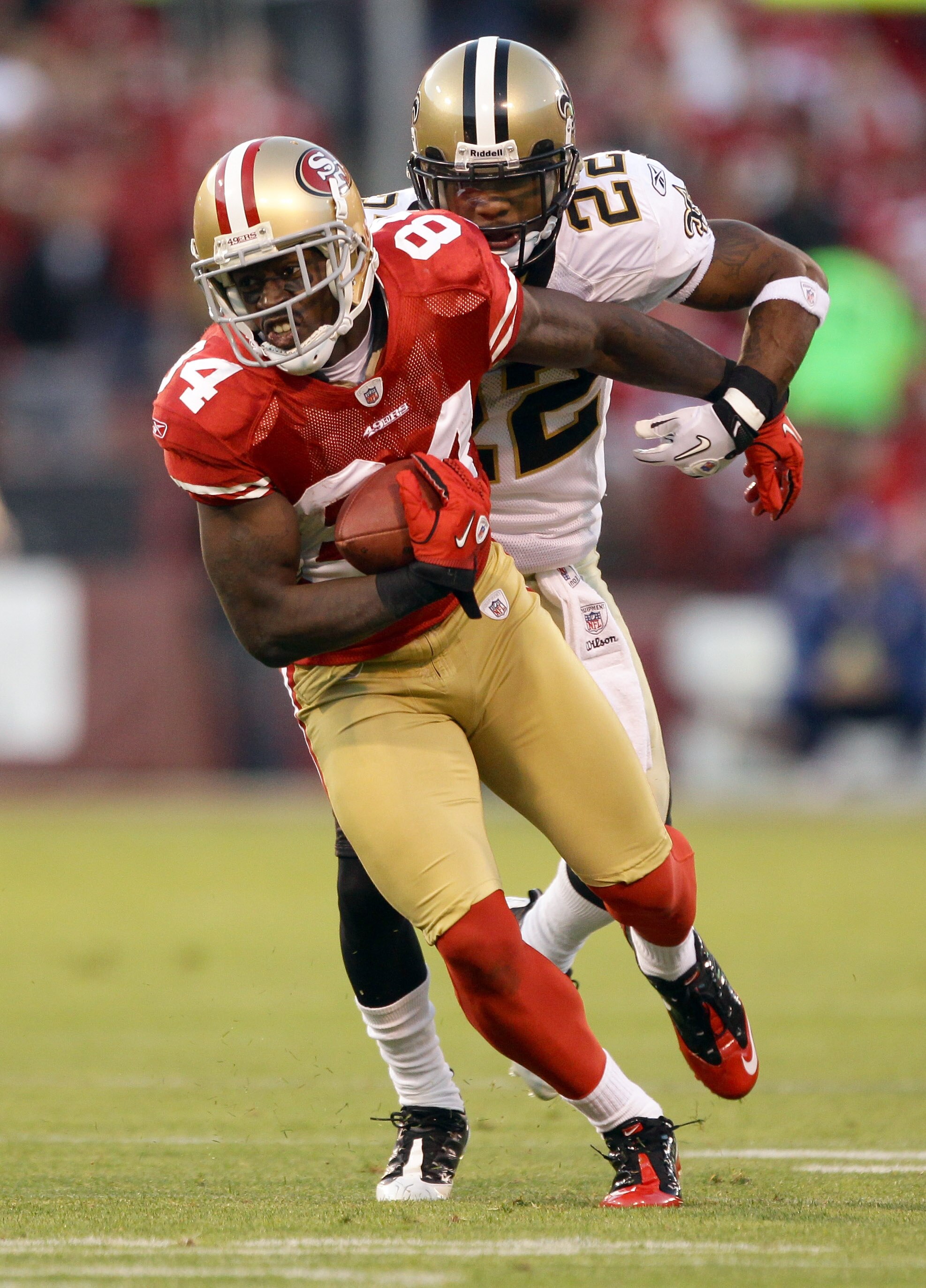 SAN FRANCISCO - SEPTEMBER 20:  Josh Morgan #84 of the San Francisco 49ers is tackled by Tracy Porter #22 of the New Orleans Saints at Candlestick Park on September 20, 2010 in San Francisco, California.  (Photo by Ezra Shaw/Getty Images)
