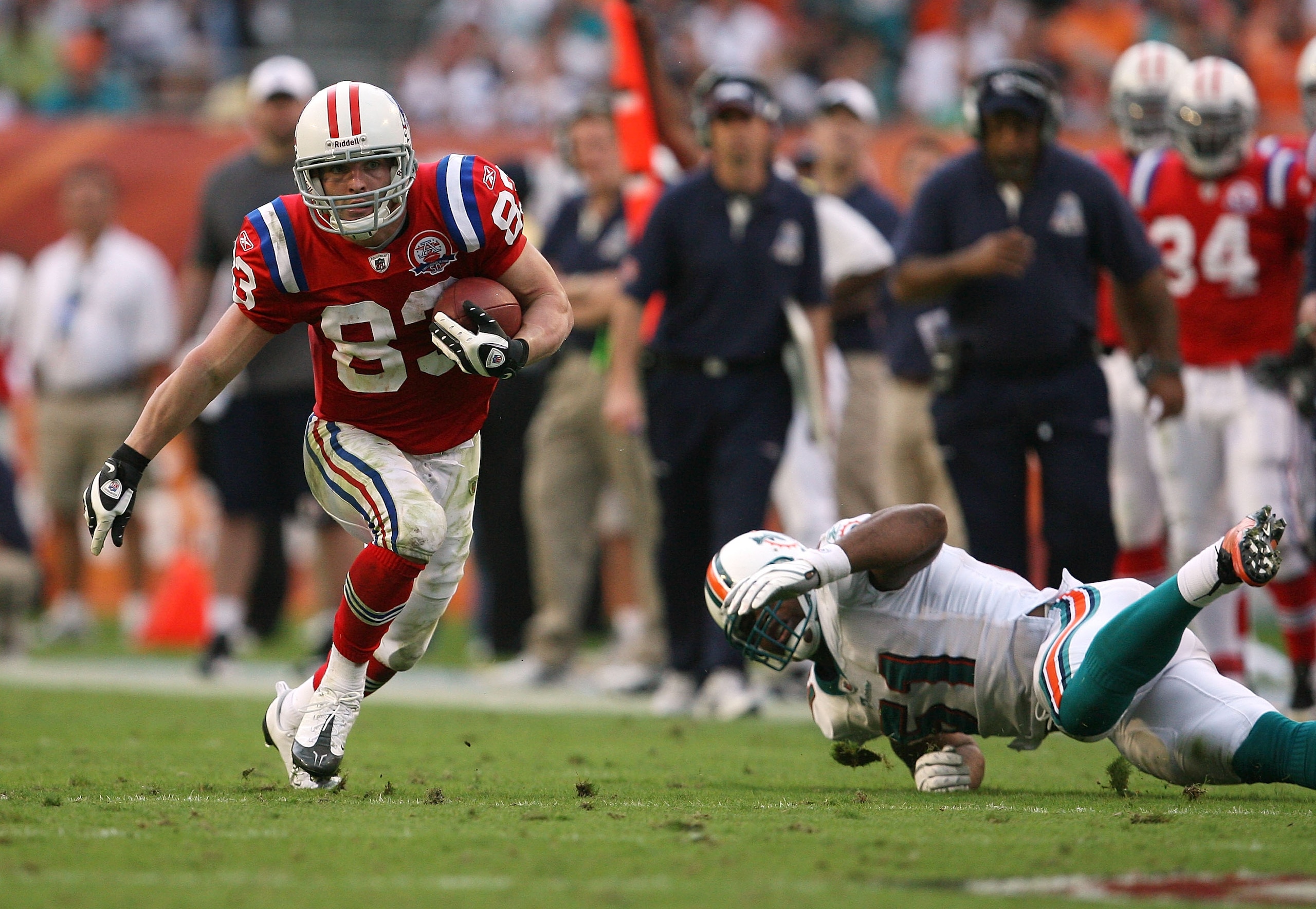 MIAMI - DECEMBER 06:  Wide receiver Wes Welker #83 of the New England Patriots gets past linebacker Akin Ayodele #51 of the Miami Dolphins at Land Shark Stadium on December 6, 2009 in Miami, Florida. The Dolphins defeated the Patriots 22-21.  (Photo by Do