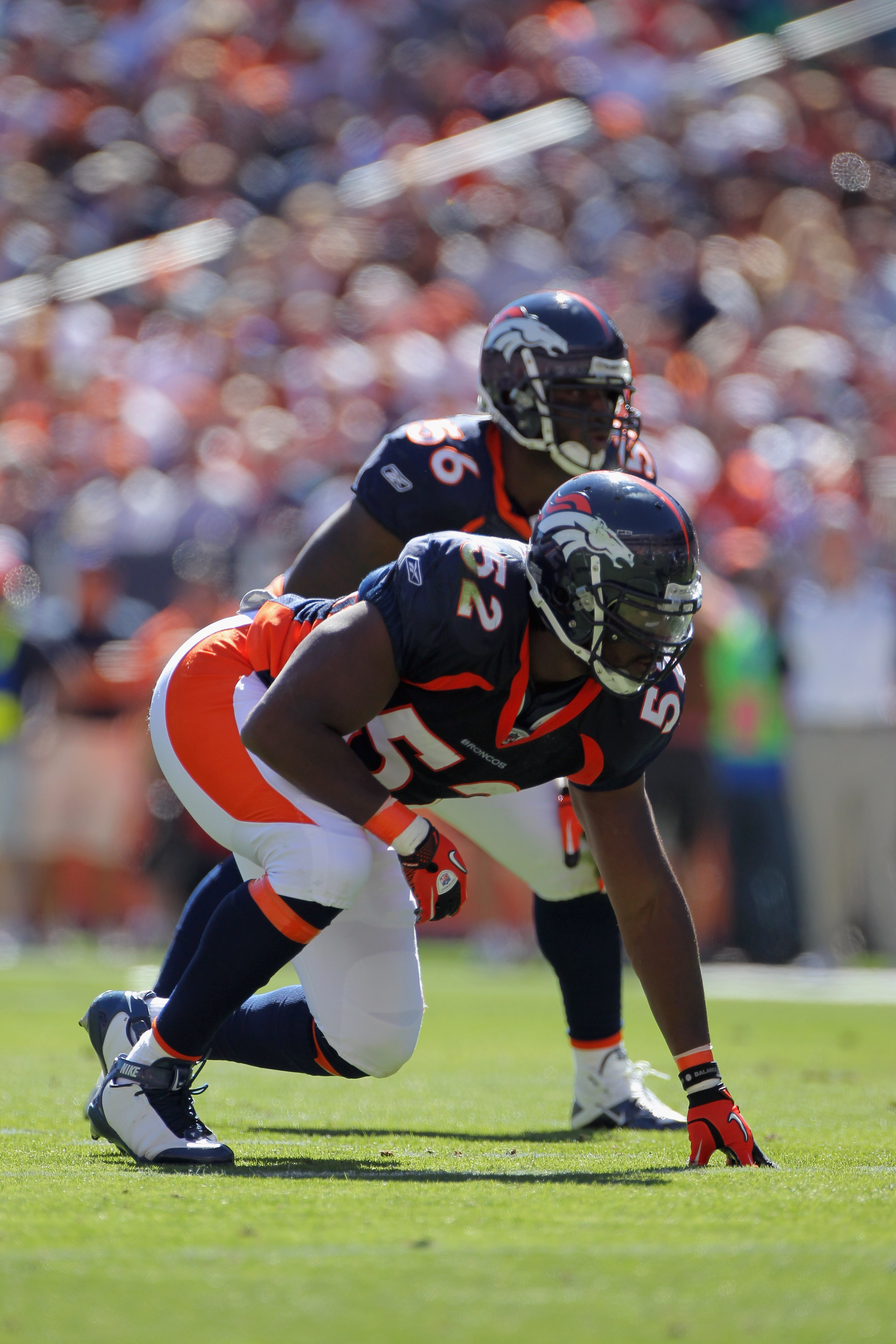 DENVER - SEPTEMBER 19:  Linebackers Jason Hunter #52 and Robert Ayers #56 of the Denver Broncos are ready for action against the Seattle Seahawks at INVESCO Field at Mile High on September 19, 2010 in Denver, Colorado. The Broncos defeated the Seahawks 31