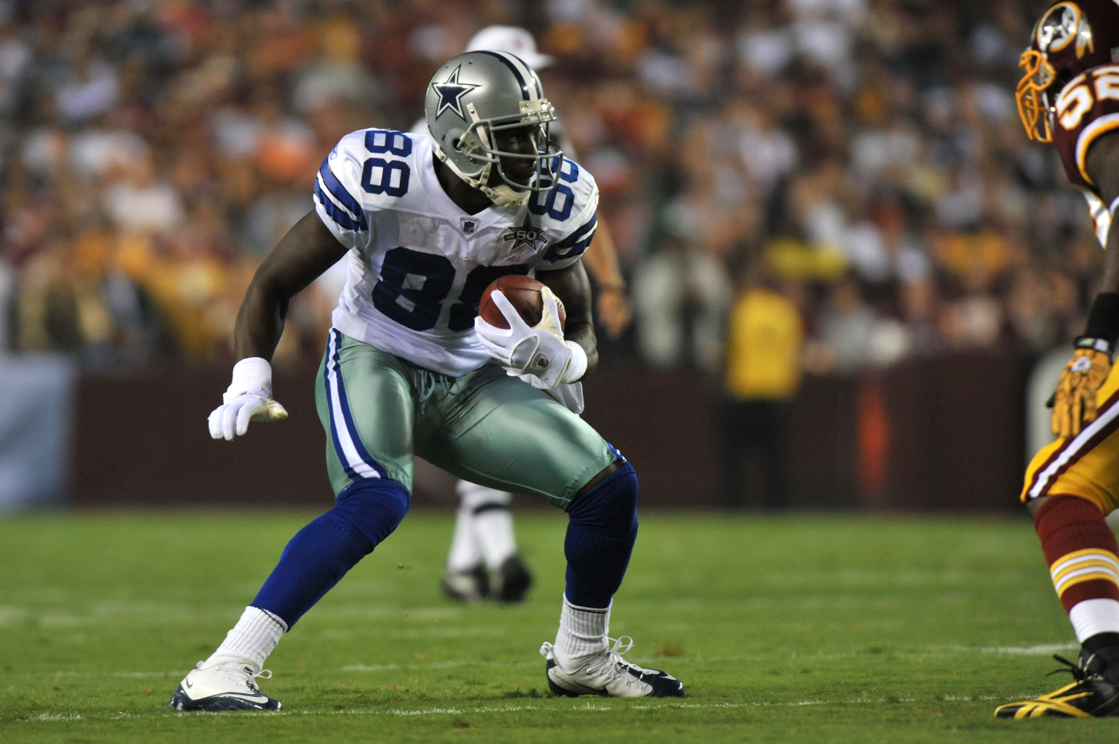 LANDOVER - SEPTEMBER 12:  Dez Bryant #88 of the Dallas Cowboys runs the ball after a catch during the NFL season opener against the Washington Redskins at FedExField on September 12, 2010 in Landover, Maryland. The Redskins defeated the Cowboys 13-7. (Pho