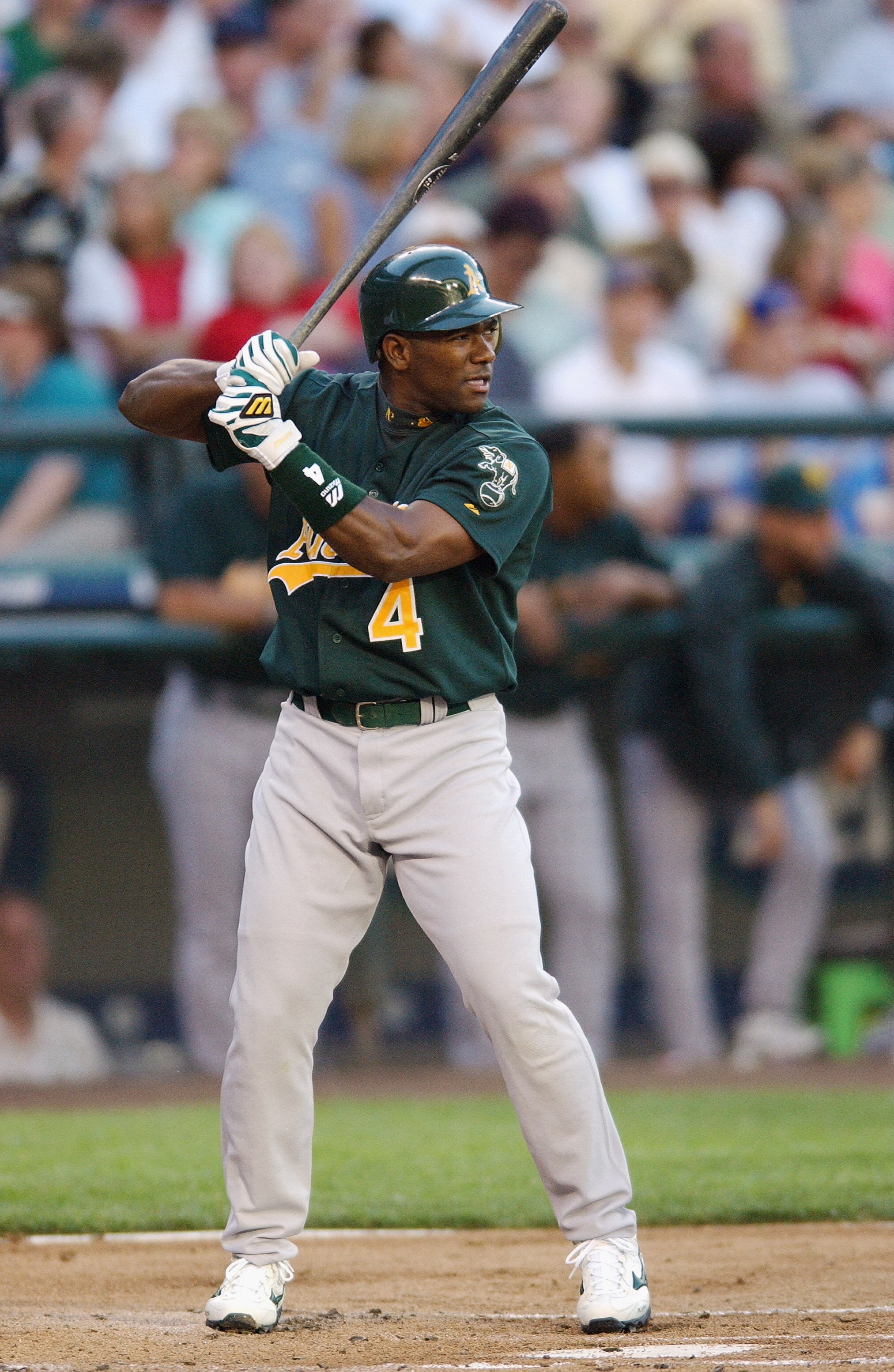 SEATTLE - JULY 23:  Miguel Tejada #4 of the Oakland A's bats against the Seattle Mariners during the game on July 23, 2003 at Safeco Field in Seattle, Washington.  The Mariners won 6-0.  (Photo by Otto Greule Jr/Getty Images)